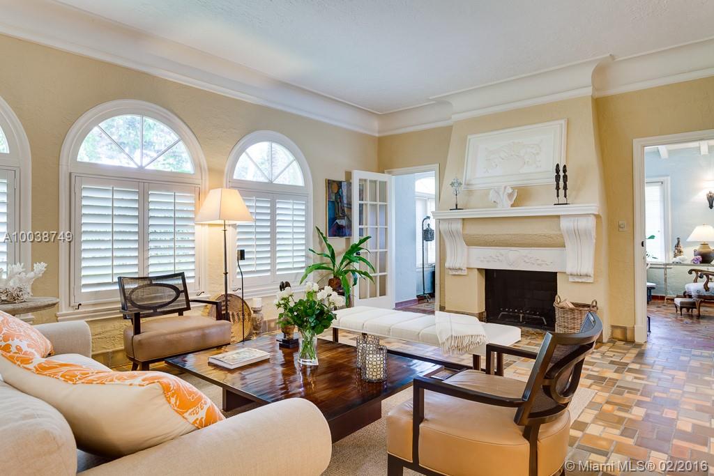 This is unquestionably one of the most beautiful Mediterranean homes on the market. Designed by Lee Wade in 1928, the home is timeless. The details in the living rm alone with its fabulous moldings, fireplace & sweeping staircase are truly incredible. The kitchen is beautifully remodeled & stayed true to the era. There is a handsome library as well as a guesthouse. The 2nd fireplace in the master br adds to its grandeur. Gated & private, it is just a short walk to Coral Gables fine dining & entertainment.