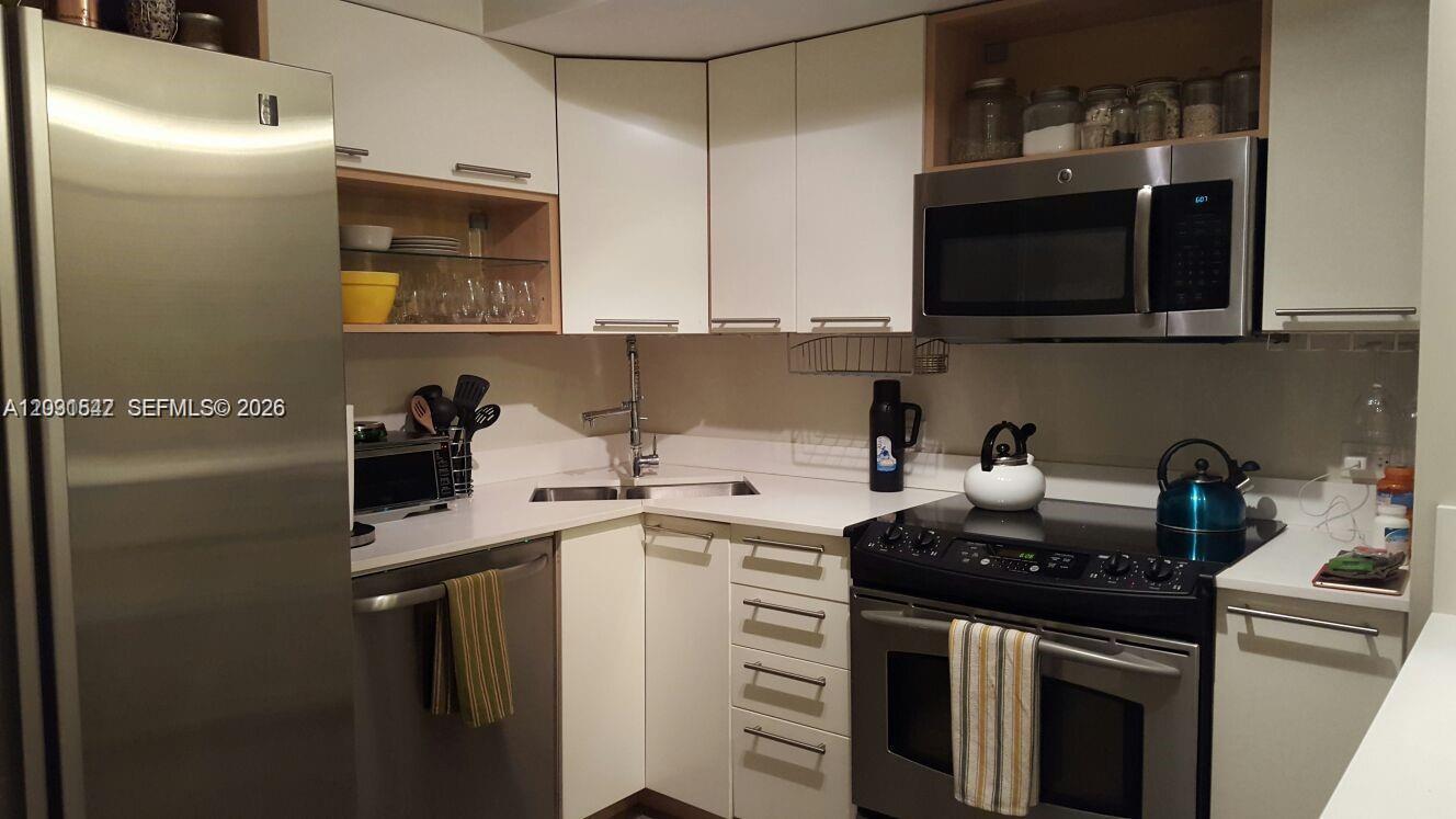 Exceptional opportunity in the heart of Bay Harbor Islands! This beautifully renovated and fully furnished 2-bedroom, 1.5-bath residence is located within a secure gated community and offers the perfect combination of comfort, convenience, and investment potential. Thoughtfully updated throughout, the unit features stylish vinyl flooring, a modern kitchen, renovated bathrooms, a newer A/C system, a spacious walk-in closet, and washer/dryer connections inside the unit.
Residents enjoy excellent building amenities, including a swimming pool, new elevator, assigned parking, additional storage, and pest control service included in the maintenance fee. The association maintains solid reserves and currently has no special assessments.
Ideally situated within walking distance of top-rated schools, Bay Harbor Shops, restaurants, cafes, and everyday conveniences, this property offers an unbeatable location in one of Miami’s most sought-after neighborhoods.
With no rental restrictions and a minimum lease term of only six months, this residence is ideal for investors seeking strong rental flexibility, as well as seasonal owners looking for the perfect vacation retreat. The unit is currently tenant-occupied, providing immediate rental income from day one. Whether you're looking for a primary residence, second home, or income-producing property, this is a rare opportunity you won’t want to miss.