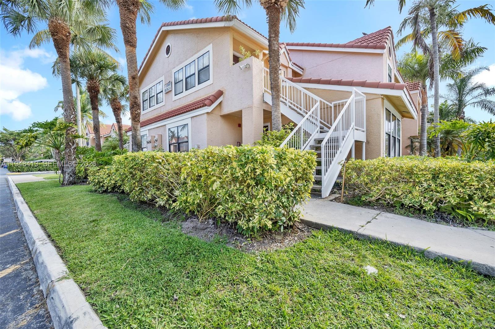 ALERT! LOWEST HOA IN THE AREA! LOOKING FOR PEACE OF MIND OF ASSESMENTS AND HIGH MAINTENANCE DON'T LOOK FURTHER. This bright 2/2 corner unit & ground floor is a rare opportunity at Biscayne Beach Club! 2-STORY BUILDING-no strict governmental inspections required. SUPER LOW AND STABLE maintenance (hasn’t increased since 2008), includes water/sewer, and NO assessments. , No Assessments, Water/sewer is included. Lot of parking spaces available in the community, Ideal as primary residence or Investment. Community is ALL Ages, Pet friendly and has No rental Restrictions. Don't miss out on this fantastic opportunity!. Features granite counters, updated kitchen, full-size washer/dryer, all-tile floors, and tons of natural light. Spacious owner's suite plus comfortable guest bedroom. Ground floor, lots of parking, prime location in Hammocks area shopping/dining. THIS IS A MUST SEE!