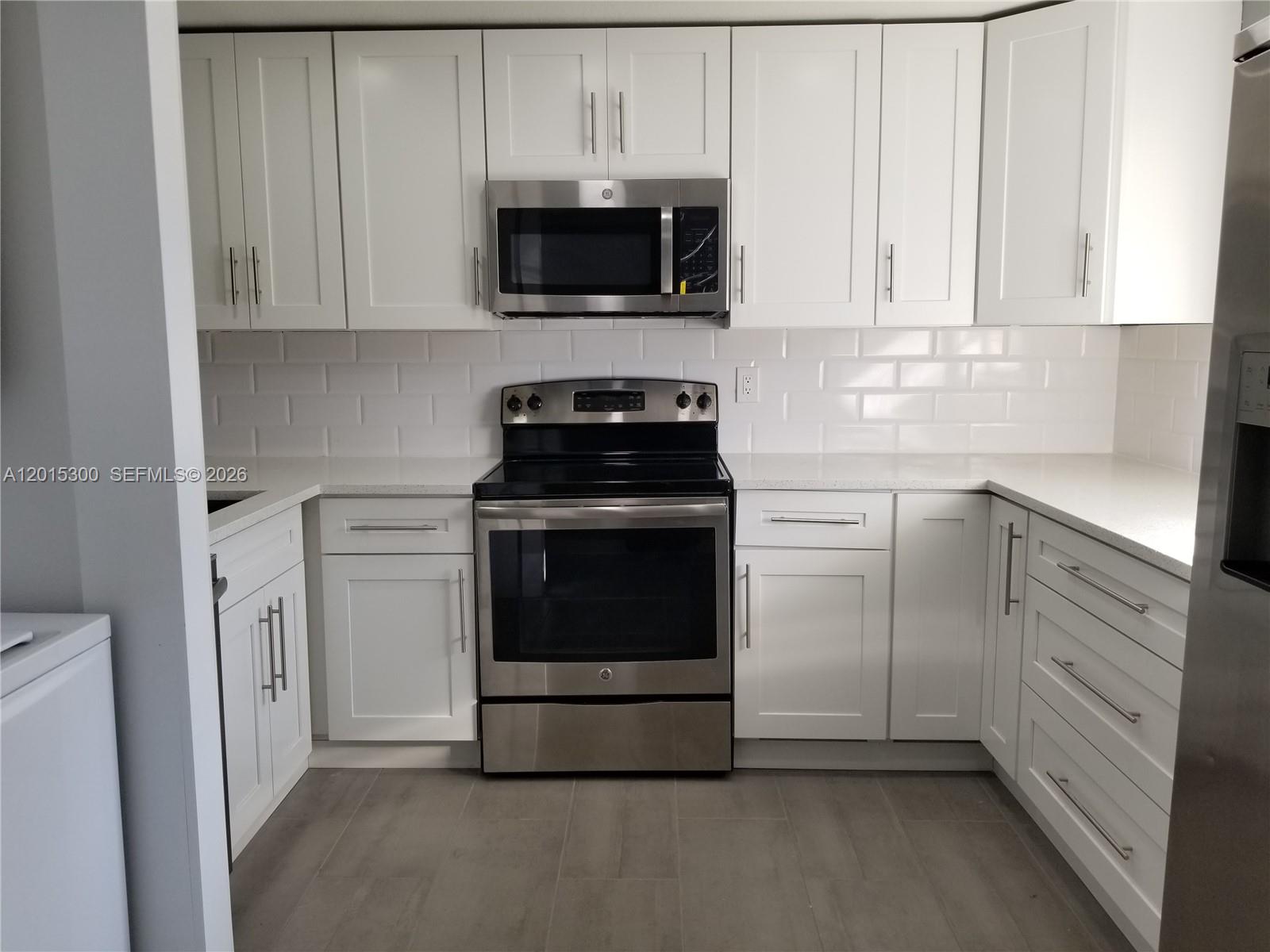 Gorgeous remodeled 2 bed 2 full baths. A must-see. Tile throughout.  Impact windows! Washer & Dryer. Enclosed balcony. Assigned parking space included. Located near busy University Drive and Sterling Road, You are close to everything. Association Fee includes Building Insurance, Water, Trash and a Club House with a Pool and Event Facility. No Commercial Vehicles Permitted
