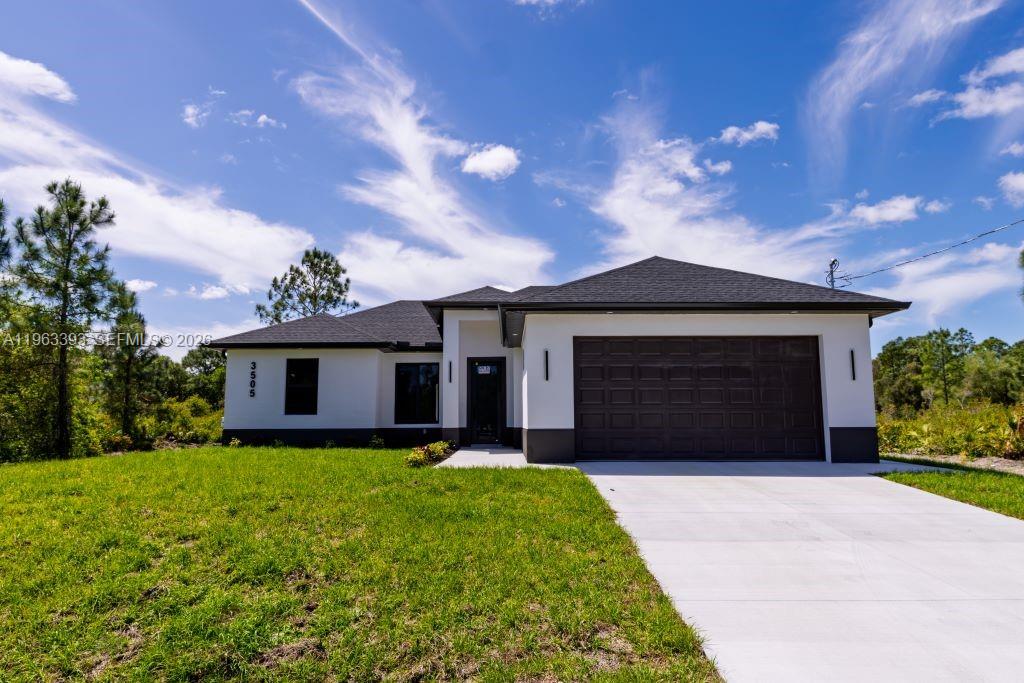 Brand New Construction!
Discover this stunning single-family home in Lehigh Acres, perfectly situated on a spacious 0.25-acre lot. This modern residence features 3 bedrooms and 3 full bathrooms, including one conveniently located in the garage, ideal for a future 4th bedroom, in-law suite, or rental efficiency.
Designed with quality and comfort in mind, the home offers impact-resistant doors and windows, central electric A/C, and ceiling fans in every bedroom for year-round comfort. The kitchen showcases a large island, ample pantry space, and sleek contemporary finishes, perfect for cooking and entertaining.
Enjoy peaceful mornings or relaxing evenings on either the front or back porch. Each bathroom is tastefully upgraded with glass shower doors and LED light mirrors, adding a touch of luxury. All closets will include custom storage options, tailored to the buyer’s preferences.
A perfect blend of comfort, style, and functionality. This home is move-in ready and waiting for your personal touch!