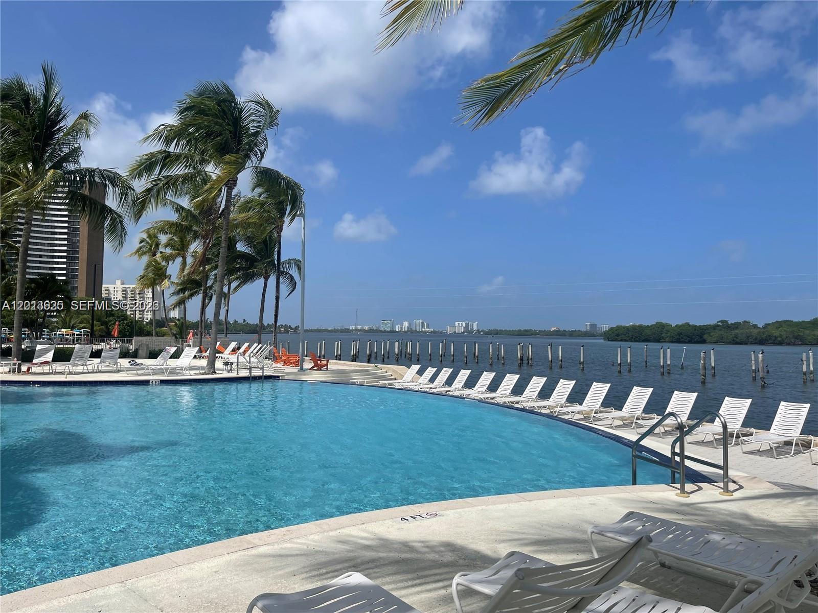 Beautiful, large 1 bedroom/1bathroom unit in the sought after Nirvana community. Situated directly on the bay, this is a resort style community with amazing amenities and lush landscaping. This impeccable unit has a fully equipped kitchen with granite counters, modern appliances, and gorgeous new flooring. Very functional and practical layout. Your amenities would include access to two pools, BBQ area, paddle board storage, sauna, gym, volleyball court, sand beach, and a convenience store/cafe. Lots of available parking for guests. Very close to Brickell, Wynwood, and the Beaches. Images are virtually staged with furniture to illustrate the potential of the space.
