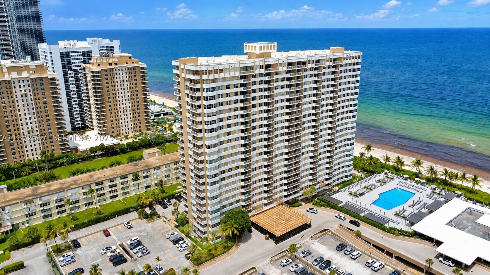 Experience luxury living with this stunning 11th-floor one-bedroom, one-and-a-half-bath condo featuring breathtaking ocean views! This spacious, bright unit offers impact windows and doors, ensuring safety and tranquility. Enjoy a modern lifestyle with access to exceptional amenities including a fitness center, 2 sparkling swimming pools with cabanas, and multiple on-site restaurants. Conveniently located with assigned covered parking, shops, and a vibrant community atmosphere. Don’t miss this incredible opportunity—your ocean-view oasis awaits!