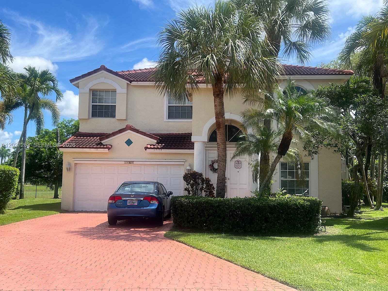 Welcome to this elegant residence located in the highly desirable gated community of Grand Palms. This spacious 2-story home features 5 bedrooms and 3 full bathrooms, and offers an expansive en-suite bedroom with a standard closet and an over-sized walk-in closet.  Two of the bedrooms share a large balcony overlooking the pool and golf course.  The pool area is fully screened in, allowing pest-free outdoor entertaining. The smart dryer situated in the dedicated laundry room, as well as the dishwasher, double-oven smart range, and capacious 29.5 Cu. Ft. French door smart refrigerator have been recently updated. Grand Palms offers resort-style amenities including a spa, fitness center, three soccer fields and three nine-hole golf courses.  This amazing location is minutes from shopping, entertainment, high-end dining, and world-class healthcare.  Commuters will appreciate quick and convenient access to I-75.