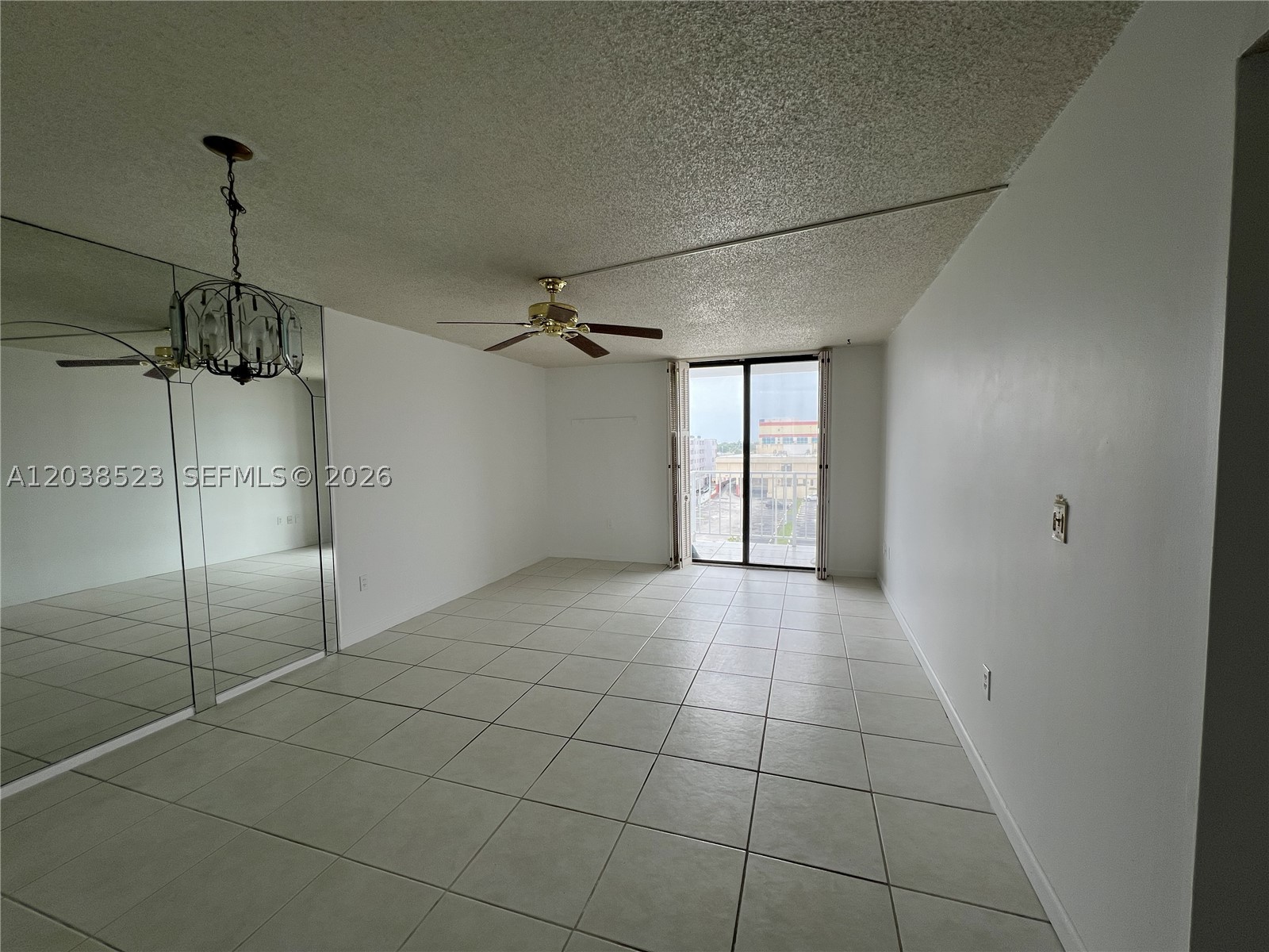 Bright and spacious 1-bedroom, 1.5-bath condo featuring a large open living and dining area, tile flooring throughout the main living spaces, and an oversized primary bedroom with generous closet space. The functional kitchen offers ample cabinetry and storage, while the private balcony provides natural light and open city views. Well-maintained and move-in ready, this unit offers a great opportunity for a primary residence, seasonal retreat, or investment property. Conveniently located near shopping, dining, entertainment, major highways, public transportation, Aventura Mall, and beautiful South Florida beaches.