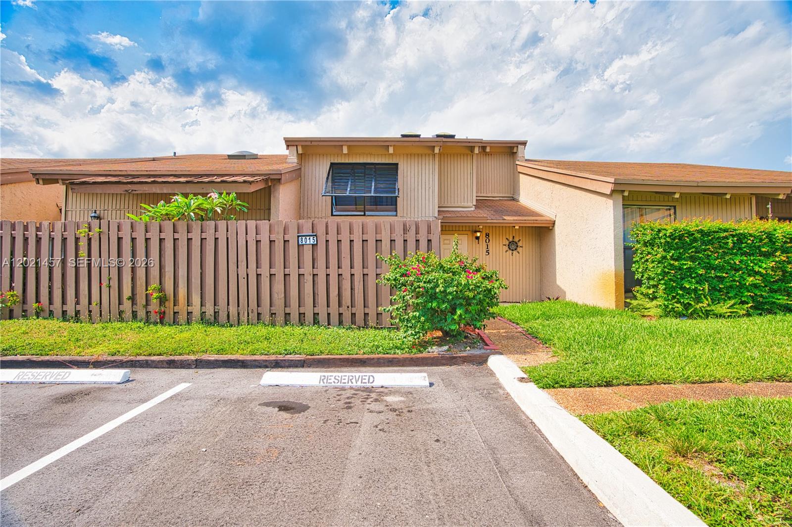 Beautifully remodeled 2-story townhouse on a 1,445 sq. ft. lot in the heart of Davie, just minutes from shopping, dining, universities, and entertainment. This spacious home features 1 bedroom, 1.5 bathrooms, plus a versatile 12’ x 12’ flex room ideal for a second bedroom, office, den, or guest space. The primary bedroom offers a walk-in closet, private balcony, and granite-top vanity. The updated kitchen includes modern cabinetry, granite countertops, stainless steel appliances, and a convenient pass-through to the dining area, which overlooks a large fenced paver patio complete with a storage shed and charming porch swing. The living room features a wet bar and sliding glass doors leading to a private front fenced patio. Natural light fills the home through two beautiful skylights, creating a bright and inviting atmosphere throughout. Community amenities include a resort-style heated pool, kiddie pool, playground, basketball and tennis courts, barbecue grills, and on-site maintenance. Pet-friendly and investor-friendly community!