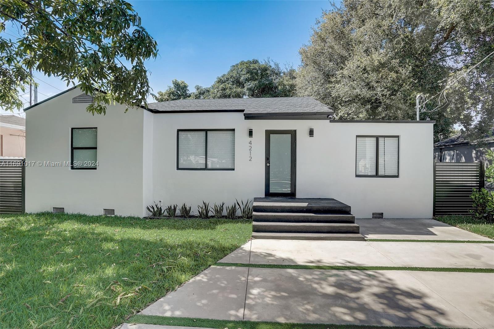 Open concept ultra-modern single family house located in Buena Vista just minutes from the heart of Wynwood and Miami’s Design District. Three bedroom, two bath house with two additional living spaces that could be used as extra rooms or office spaces. Kitchen features modern high gloss cabinets w/ waterfall quartz countertops. Samsung Bespoke smart appliances including washer & dryer & Nest thermostat. Impact windows and roof updated in 2020. Property is zoned for Airbnb. Additionally, the large backyard (5,000 sq ft lot) has a restored pizza oven adding charm to the house and front gate is automatic.