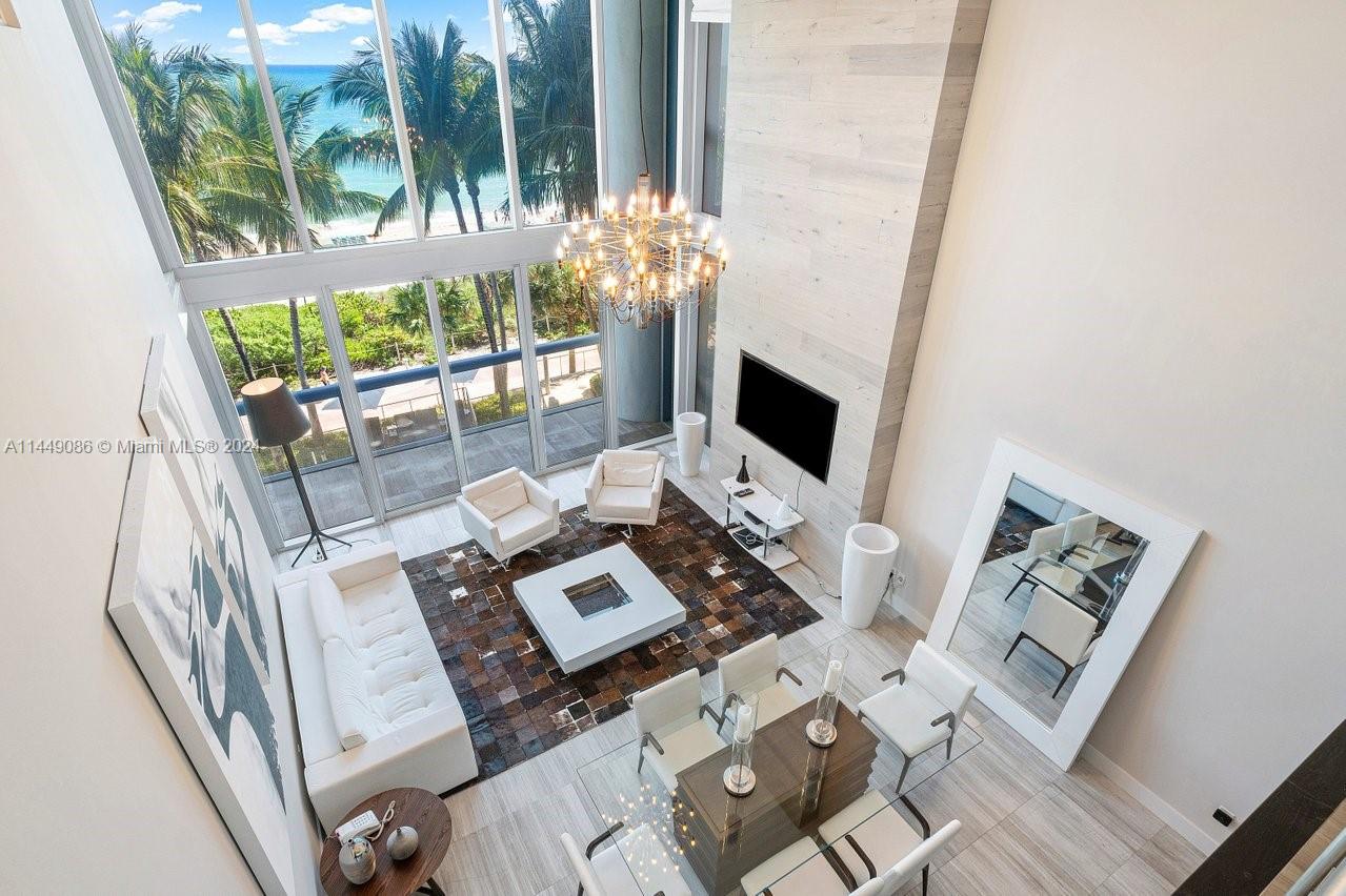 RARELY AVAILABLE TOWNHOME OPPORTUNITY - Experience elevated, direct east views in your own private townhome oasis, at the exclusive, full service, Carillon resort. 

This rarely available and most sought after line features a luxurious 2bd/3.5bth+ den and spans over 3,100 sqft of turnkey living space that seamlessly flows with elegance and simplicity.  

As you enter the double door entrance, you are greeted by a grand, double-high ceiling hallway that leads you to the den w/full bath, powder room and elegant staircase. 

A state of the art, pristine, open kitchen, awaits you just beyond the stairs, fully equipped with Miele & Subzero appliances including double ovens and an integrated coffee maker.