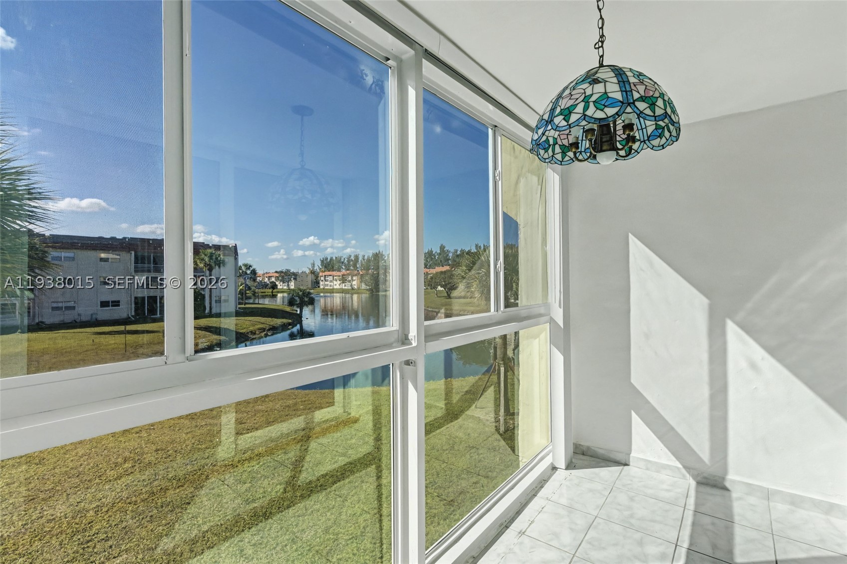 Updated waterfront 2/2 on the 2nd floor of Building 12, just steps from the Satellite 15 pool.  Impact windows throughout, including the enclosed balcony as well as the sliding glass doors to the balcony. New stainless steel appliances in the kitchen, updated bathrooms and walk-in closets. Gorgeous lake views from the balcony as well as the primary bedroom. Unit has just been professionally painted. Extra storage and laundry area located on the same floor. Home is ready for your personal touches. Amenities include pool, fitness center, clubhouse, theater, transportation, cable. COA says 55+, no leasing and no pets. 50 year re-certifications have been completed. Some trucks are OK, contact agent to confirm.