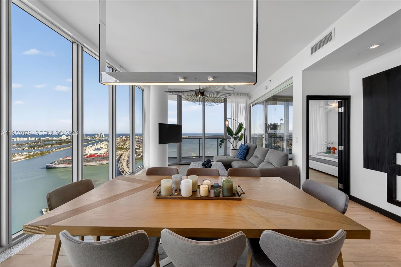Experience Marina Blue’s coveted 08 line, known for its sweeping, unobstructed views spanning Sunny Isles, Miami Beach, Key Biscayne, Edgewater, Brickell, and Downtown Miami. One of only three residences crowning the building’s uppermost waterfront tier, this high-floor home offers a rare panoramic vantage point seldom available.

Featuring 10-foot ceilings, the residence has been thoughtfully updated with brand new flooring and a refined floor plan designed to enhance the living area and fully capture its panoramic exposure. The home offers 2 bedrooms, 2 baths, floor-to-ceiling glass, electric blackout shades, in-unit washer and dryer, and stunning water and skyline views from every room. An additional west-facing balcony provides sunset and city light views.

Ideally located across from Kaseya Center and one block from Miami Worldcenter, dining, shopping, and the Apple Store. Marina Blue offers resort-style pools, fitness center, business center, jacuzzi, BBQ areas, mini market, and CVS on site.

A limited opportunity for the next fortunate owner at the architectural apex of the 08 line.