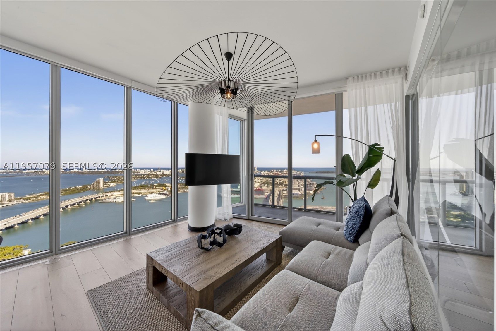 Be the fortunate buyer to own one of Marina Blue's most sought-after residences, the coveted high-floor 08 line. Positioned on one of the building's highest waterfront levels, this residence showcases sweeping views spanning Sunny Isles, Miami Beach, Key Biscayne, Edgewater, Brickell, and Downtown Miami.

The residence features 2 bedrooms, 2 bathrooms, 10-foot ceilings, floor-to-ceiling windows, electric blackout shades, washer and dryer, and breathtaking water and city views from every room. An additional west-facing balcony provides beautiful sunset and skyline views.

Conveniently located directly across from Kaseya Center and one block from Miami Worldcenter and the Apple Store, residents enjoy immediate access to premier shopping, dining, entertainment, major events, and Miami's renowned nightlife. Ideal for buyers seeking a walkable lifestyle with Miami's top attractions just steps from their front door, while remaining only 15 minutes from Miami International Airport. Amenities include two swimming pools, fitness center, business center, jacuzzi, BBQ areas, mini market, and CVS on site.

Opportunities to acquire a high-floor 08 line are limited. Don't miss the opportunity to own one of Miami's most desirable unobstructed panoramic bay and skyline views.
