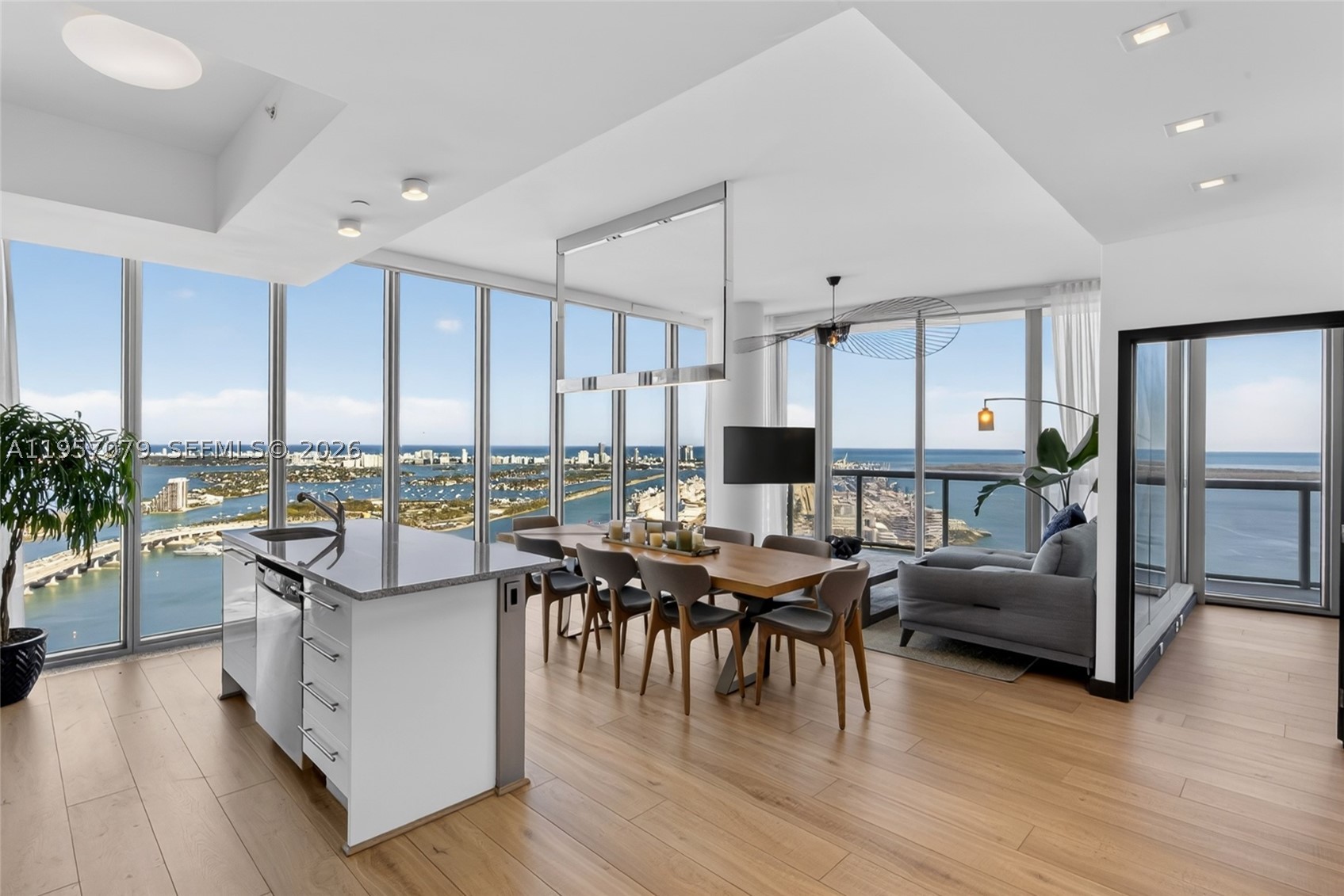 Be the fortunate buyer to own one of Marina Blue's most sought-after residences, the coveted high-floor 08 line. Positioned on one of the building's highest waterfront levels, this residence showcases sweeping views spanning Sunny Isles, Miami Beach, Key Biscayne, Edgewater, Brickell, and Downtown Miami.

The residence features 2 bedrooms, 2 bathrooms, 10-foot ceilings, floor-to-ceiling windows, electric blackout shades, washer and dryer, and breathtaking water and city views from every room. An additional west-facing balcony provides beautiful sunset and skyline views.

Conveniently located directly across from Kaseya Center and one block from Miami Worldcenter and the Apple Store, residents enjoy immediate access to premier shopping, dining, entertainment, major events, and Miami's renowned nightlife. Ideal for buyers seeking a walkable lifestyle with Miami's top attractions just steps from their front door, while remaining only 15 minutes from Miami International Airport. Amenities include two swimming pools, fitness center, business center, jacuzzi, BBQ areas, mini market, and CVS on site.

Opportunities to acquire a high-floor 08 line are limited. Don't miss the opportunity to own one of Miami's most desirable unobstructed panoramic bay and skyline views.