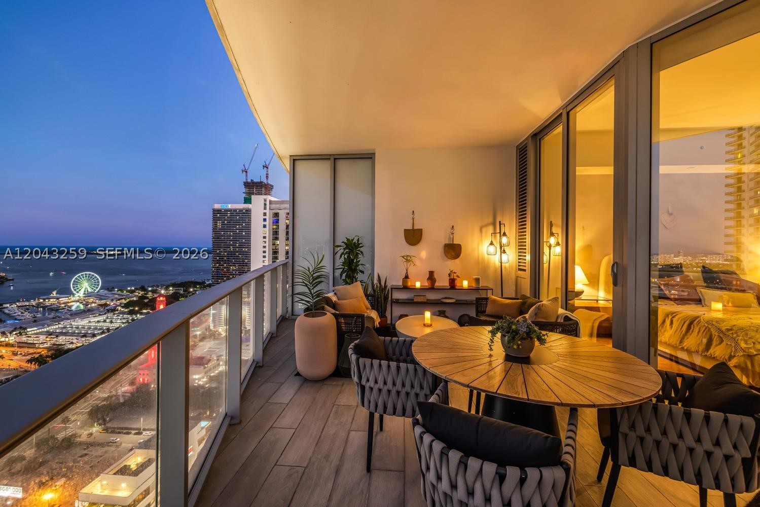 One of only a handful of residences in the building with an extended wraparound balcony — and the only one currently available. 3403 is a rare opportunity to own something genuinely different in Miami's most amenity-rich tower.
This beautifully curated 2-bedroom + den, 3-bath residence on the 34th floor has been thoughtfully upgraded throughout — custom lighting, elevated fixtures, and carefully considered finishes that set it apart the moment you walk in. The result is a home that feels designed, not dressed.
The wraparound balcony delivers panoramic bay and Miami skyline views across multiple exposures, creating an outdoor living experience that simply doesn't exist elsewhere in the building at this price point. Whether you're having morning coffee or entertaining at night, it changes how you live in the space.
Inside, floor-to-ceiling windows flood the open-plan living areas with natural light. The kitchen features Sub-Zero and Bosch appliances, complemented by a split-bedroom layout and a flexible den that functions equally well as a third bedroom, home office, or guest suite. Private elevator access opens to your own foyer.
Paramount Miami Worldcenter delivers an amenity collection unmatched anywhere in the world — five pools, rooftop sky deck, spa, golf simulator, basketball court, yoga studio, theater, co-working spaces, 24-hour concierge and valet. Steps from Brightline, Kaseya Center, and the best of Downtown Miami and Miami Worldcenter.