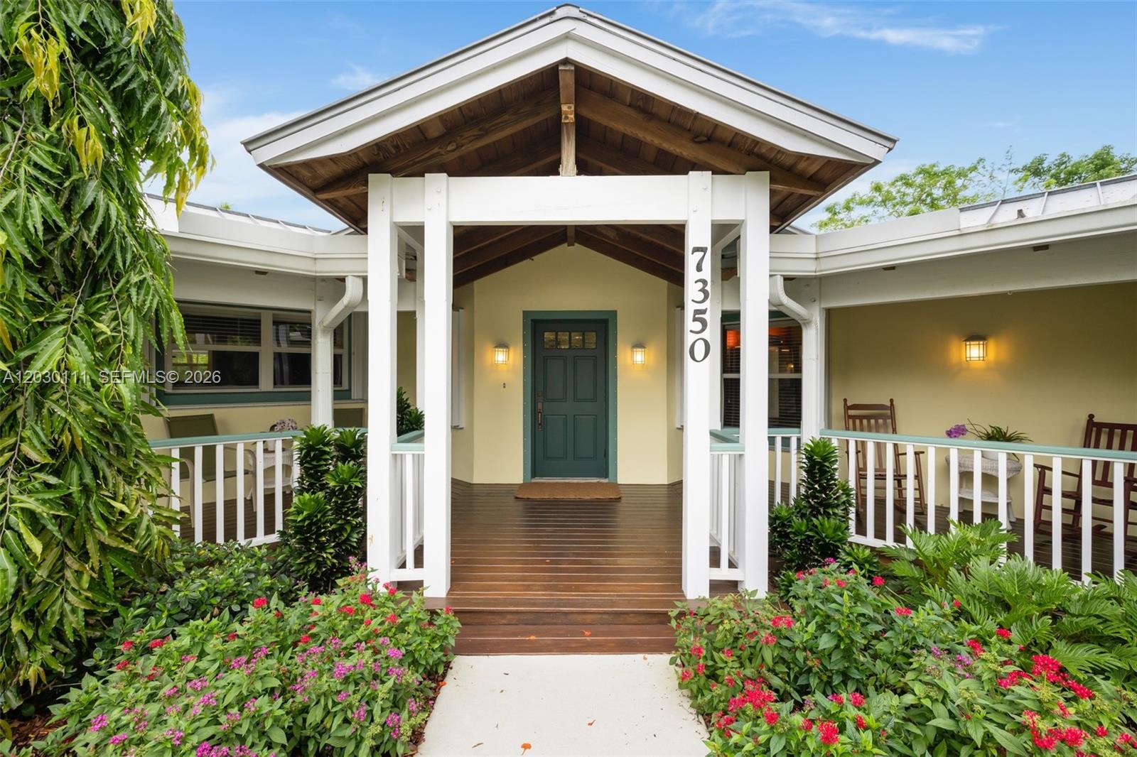 [A Miami Signature Home]
The Veranda — A rare opportunity to reimagine a sprawling one-story residence full of character, charm, and endless potential. Named for its inviting and oversized front veranda, this home evokes a relaxed Key West sensibility and offers the perfect place to sit a spell and enjoy the surroundings.
Inside, soaring volume ceilings create an airy sense of space, while distinctive Quarry tile floors enrich the formal living areas and classic Terrazzo floors extend throughout the bedroom wings. Offering the ideal canvas for renovation, the residence invites you to update and personalize to your own taste and vision.
Thoughtfully designed for comfortable living, the floor plan includes an office, indoor laundry room, and a flex-space room to suit your lifestyle needs. A fireplace adds warmth and character, while paid-in-full solar panels provide exceptional energy efficiency and dramatically reduce utility costs.
Set on an expansive half+ acre lot, the grounds are a tropical retreat featuring colorful landscaping, mature fruit trees, and a pool — creating the perfect backdrop for outdoor living and entertaining. Equal parts charm, space, and opportunity, The Veranda is ready for its next chapter.