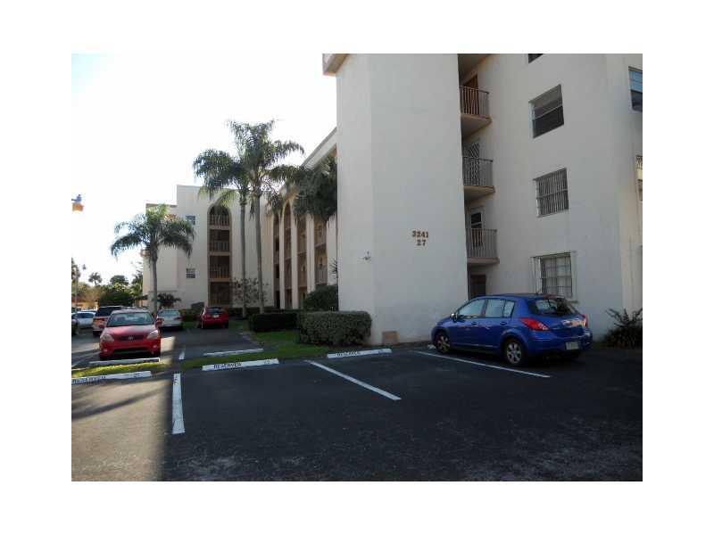 OUTSTANDING DELUXE APARTMENT WITH THE MOST EXQUSITE GOLF COURSE AND WIDE WATER VIEWS.Updated kitchen with granite counter tops, OVERSIZED ROOMS WITH WONDERFUL CLOSET SPACE. WASHER, DRYER IN APARTMENT ALSO. NEW CERAMIC TILE IN LIVING AREAS EXCEPT CARPET IN  THE BEDROOMS. HUGE SCREEN PATIO. THIS IS A MUST SEE. ASSOC REPRESENTS 55+. RESORT STYLE CLUBHOUSE AND POOL AREA.