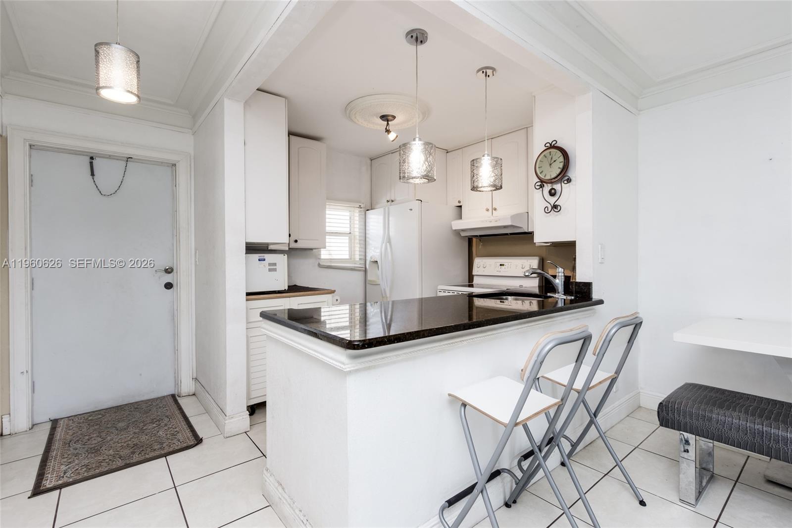 Back on the market with major updates completed! Wind insurance is now in place, and the brand-new roof—previously holding up the sale—has been fully completed. This bright corner-unit condo features an updated kitchen and tastefully renovated bathrooms, offering spacious rooms filled with abundant natural light throughout. Enjoy resort-style amenities including two pools (one heated), a fully equipped gym, and a quiet library. Golf enthusiasts will appreciate the nearby golf courses just minutes away. The community also offers on-site janitorial and maintenance staff available throughout the week for added convenience. Ideally located close to a wide variety of international dining options, major highways, shopping, Fort Lauderdale Beach, and the airport. Very low maintenance fees make this an excellent value. This is a 55+ community (at least one occupant must be 55 or older). HOA requirements include a minimum 650 credit score and minimum total household income of $45,000.