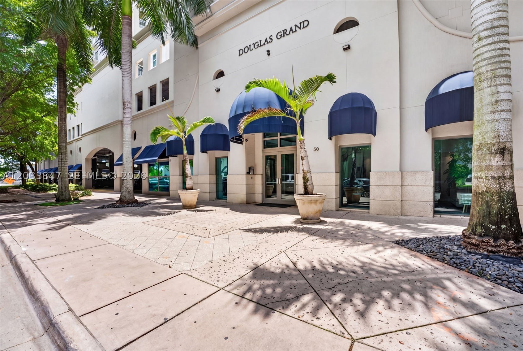 Nicely maintained, one Bedroom/ one bath residence in the heart of prestigious Coral Gables. Located in the highly desirable Douglas Grand, one of the area's most convenient buildings, with Publix Supermarket right on the ground floor. This bright and spacious unit is filled with natural light and features an open-concept kitchen with newer appliances.  Additional highlights include a washer and dryer, walk-in closet, a Juliet balcony offering resort like, pool views and breathtaking sunset vistas.  Residents enjoy exceptional amenities, including a swimming pool, fitness center, concierge service, secured entry, and an assigned covered parking space. Rent includes water, basic cable and internet.  Ideally situated near shopping, dining, entertainment, and all that Coral Gables has to offer. Vacant and Easy to show.
