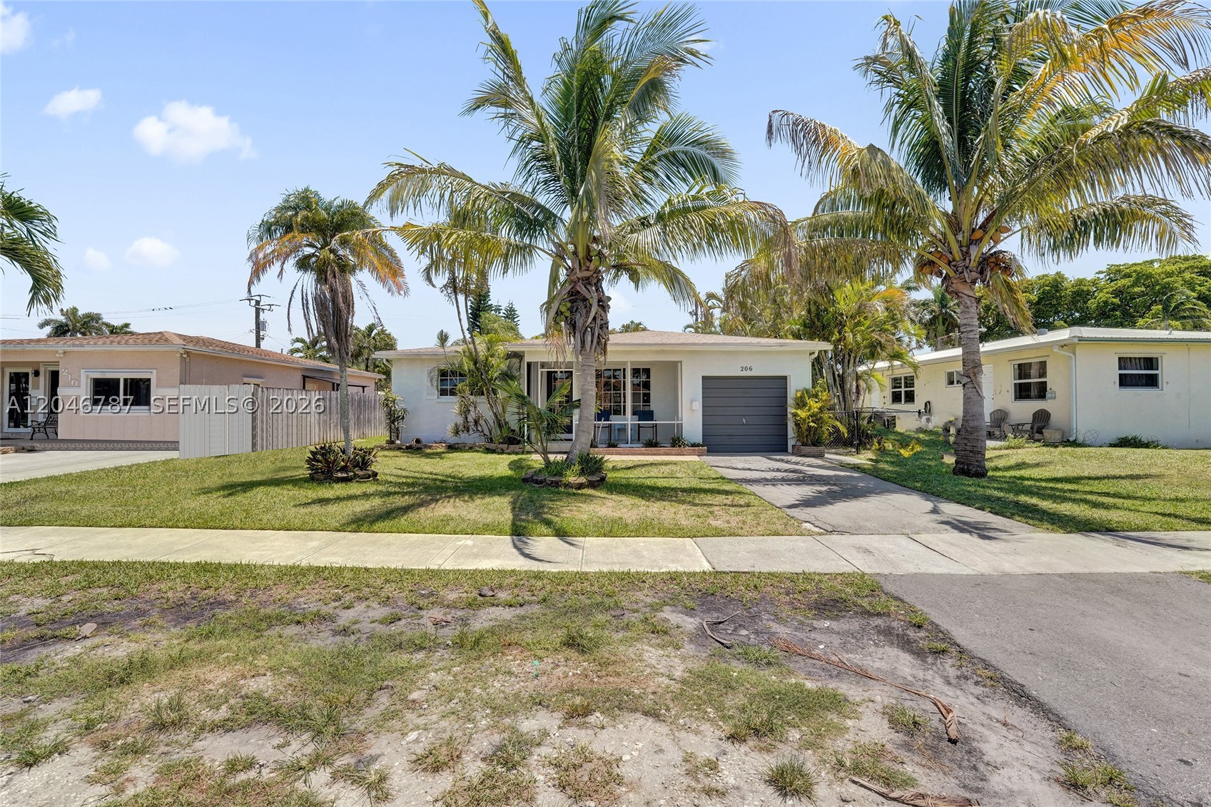 Amazing 3/1 house plus a 2nd bathroom with an outdoor shower by the pool. House has beautiful light Terrazzo floor under wood floors. House has garage converted to 3rd bedroom but can easily be converted back. In back you have a beautiful pool area on an alley. Close to schools and beach. Roof is from 2024. Fridge is new. Seller will consider contribution toward buyer closing costs.
