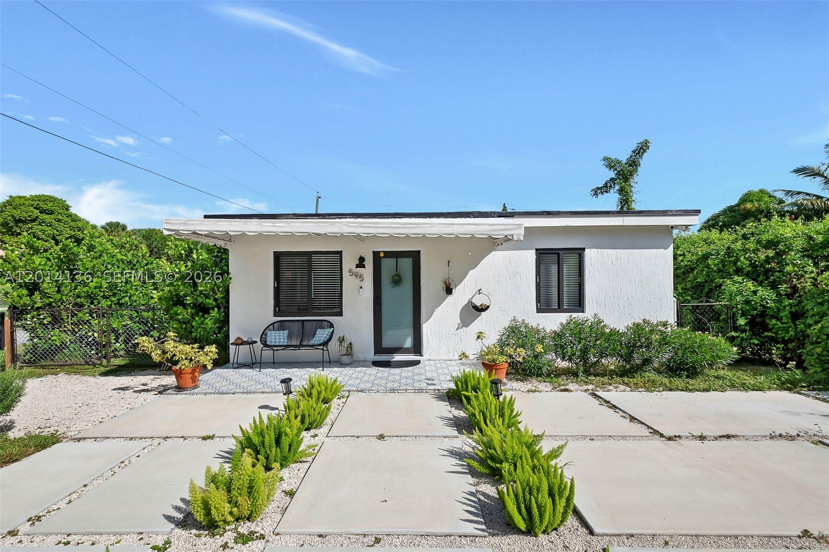 Welcome to this beautifully update gem in the heart of Miami! This charming 3 bedroom, 2 bath single family home offers the perfect blend of comfort, style, and convenience. Step inside to find an open-concept layout filled with natural light, sleek tile flooring, and a modern kitchen featuring stainless steel appliances and quartz countertops. The spacious backyard is ideal for entertaining or relaxing under the Florida sun, with room for a pool or garden oasis. The flexible floor plan allows for the conversion of one bedroom and one bathroom into a private in-law suite or use as an efficiency for income potential. Brand new concrete driveway and a private exterior gate framed by lush landscaping. Nestled on a quiet residential street just minutes from I-95. Move-in ready and no HOA!