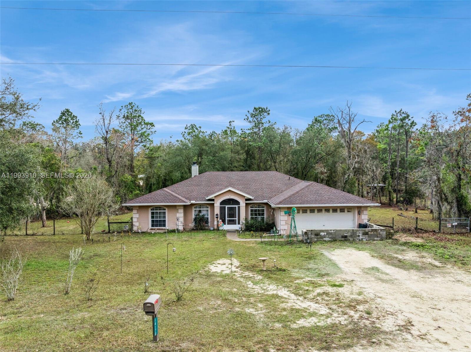 Welcome home to this spacious four-bedroom, three-bathroom retreat featuring a dedicated office and nearly 2,500 square feet of bright, functional living space. Situated on a beautiful 2.5-acre corner lot, this property perfectly balances rural tranquility with modern peace of mind. Buyers will appreciate the exceptional long-term value and immediate move-in readiness provided by a brand-new roof completed in September 2025, a two-car garage, and impact-rated windows and doors throughout the entire home.

Inside, the welcoming layout flows effortlessly and features a recently renovated primary bathroom alongside a spectacular, private guest suite. Ideal for multi-generational living or hosting visitors, this self-contained wing boasts its own private foyer and sitting area, a large walk-in closet, and a full bathroom complete with both a walk-in shower and a relaxing jacuzzi tub.

The location seamlessly blends a peaceful country lifestyle with easy accessibility, sitting just 12 minutes from town. Outdoor enthusiasts and commuters alike will love the proximity to world-class natural springs, equestrian centers, and eco-tourism hubs, including Devil’s Den, Blue Grotto, Black Prong, and Two Tails Ranch. Best of all, you are just 35 minutes to Gainesville, 45 minutes to Ocala, and 45 minutes to the coastal charm of Cedar Key. With thoughtful updates, flexible living spaces, and expansive land to enjoy, this property offers the ultimate Florida lifestyle inside and out.