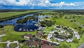 Located next door to the Port LaBelle Marina the Villas at River Run are a hidden gem in the LaBelle area! This 2-bedroom 2 bath ground floor unit is perfect for anyone wanting an easier, affordable lifestyle. This unit features a private courtyard area + a screened lanai and is just steps from the community gazebo and barbeque grills. This is ideal for boaters being adjacent to the Marina for your boat! This unit is going to need some TLC but is priced to sell.
