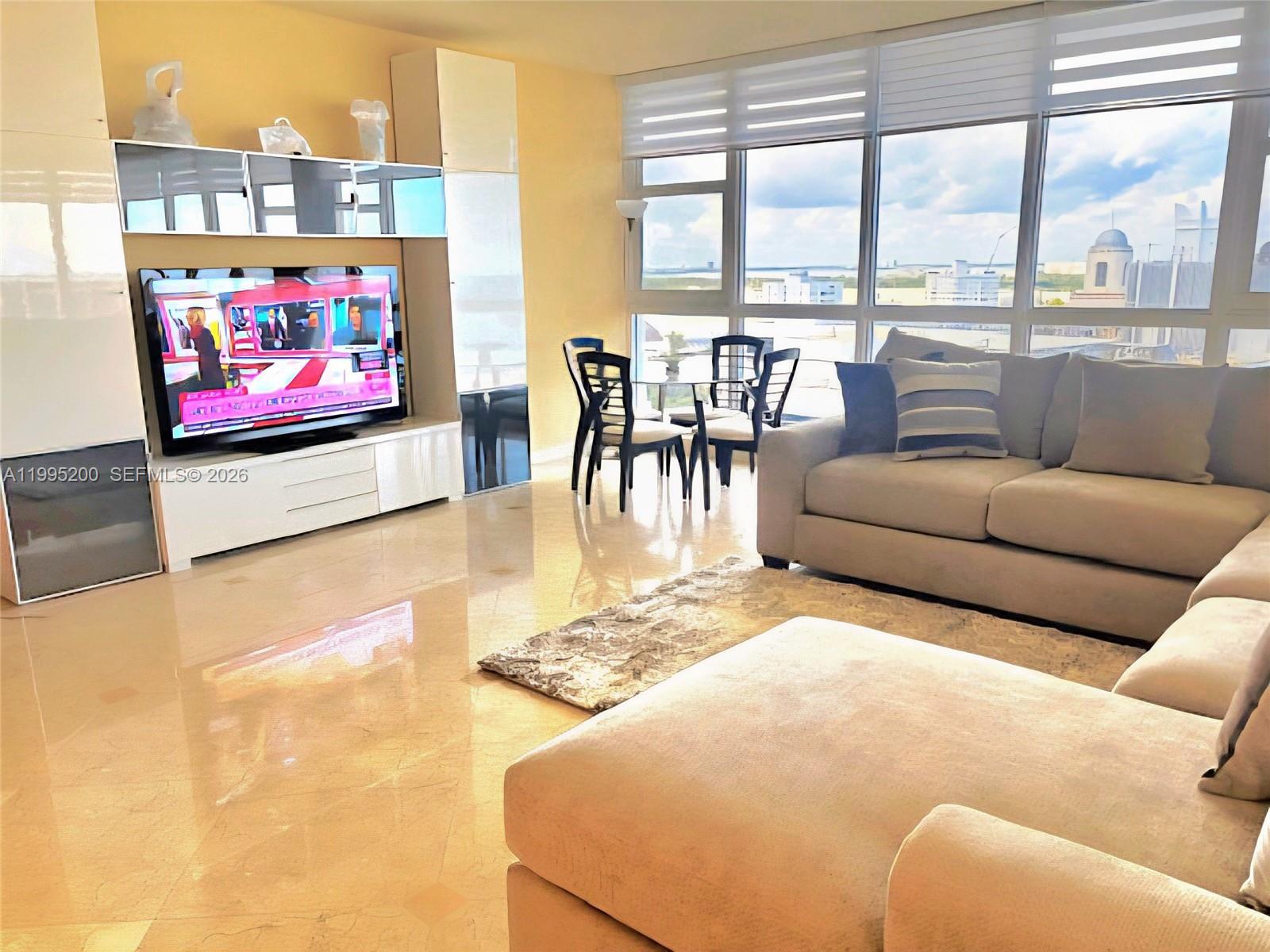 Rarely available PH unit in the Highrise Decoplage Condominium, located on famous Lincoln Rd., across the Ritz Carlton Hotel with a spectacular NE corner view, has 3 bedrooms and 3 full baths, with 2400 sq. ft of living space and a very unique city & ocean view. Apx. 5000 sq. ft. of roof terrace for the use of PH4 only (LCE) with two access doors from the unit ready to be finished for your entertainment needs, subject to the homeowner's association and the City of Miami Beach approval. Floor to ceiling hurricane impact windows throughout. The unit features an open kitchen, s/steel appliances, laundry room with full size washer & dryer, master bedroom comes a large bathroom with jacuzzi tub and shower. Furniture is included.  Monthly maintenance includes water, cable T.V., and WIFI, Unit comes with 2 assigned parking spaces and one free valet space.  Building has a gym, large climatized pool, business center, children's play area, 24-hour security and valet service.  Great investment property!!  Building allows 12 leases per year.  Easy to show.   SELLER HAS PAID OFF THE CURRENT SPECIAL ASSESSMENT!  Easy to show!!         OPEN HOUSE THIS COMING THURSDAY, MAY 14, FROM 1 TO 4 P.M.