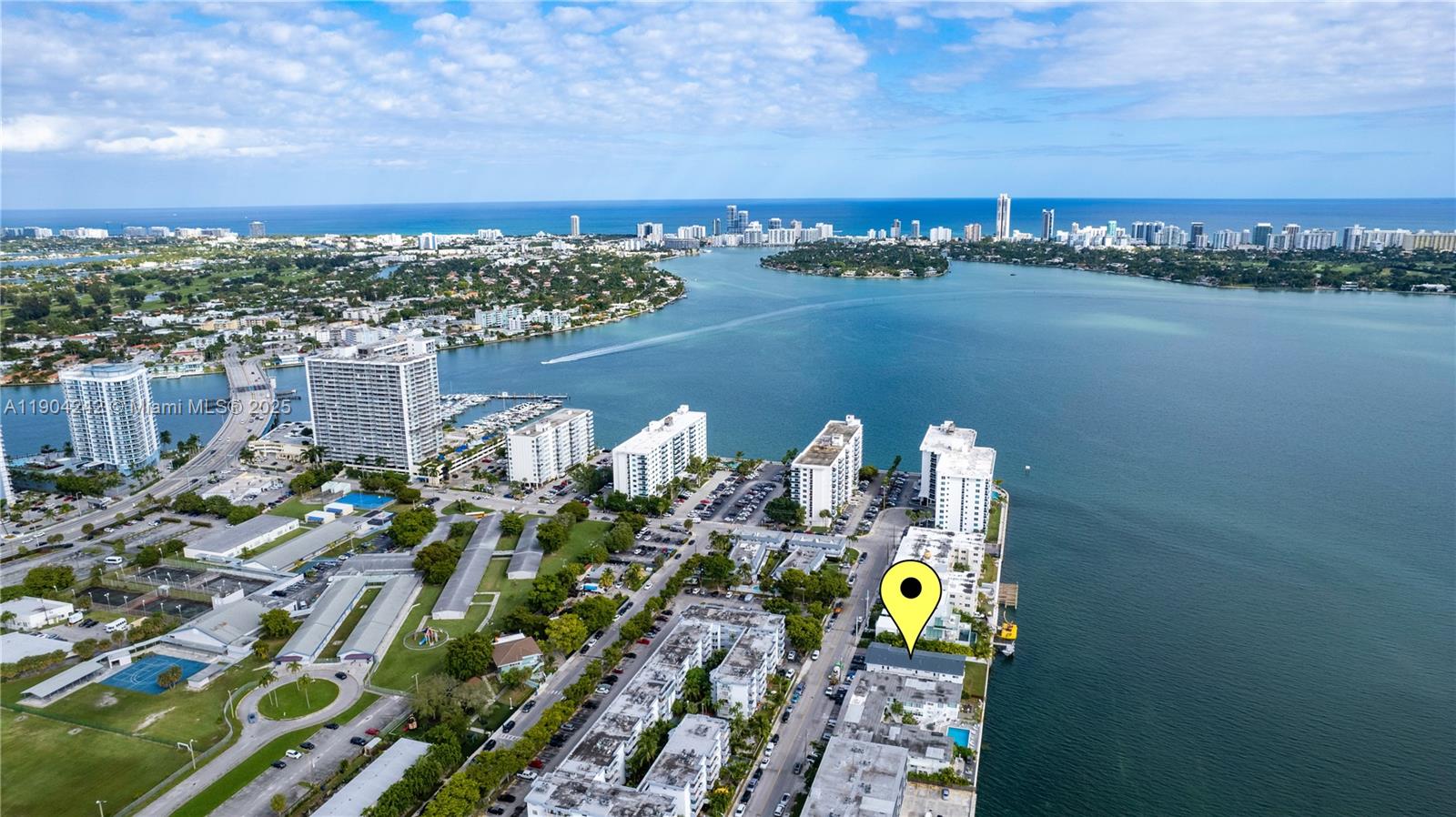 Discover this sleek 1BD residence in a beautifully designed BAYFRONT building. This top floor unit offers wood-tone floors throughout, a gourmet kitchen with premium SS appliances, quartz counters & custom cabinets, impact glass doors and windows, a stylish bath with matching vanity and 3D tile walls, plus central A/C. Wake up to stunning water views, enjoy fresh ocean breezes from the tranquil green space, or stroll to nearby shops and dining in North Bay Village, with onsite laundry for extra convenience. Pets welcomed. Assigned parking available for rent at $100/m!Check out the Virtual Tour!