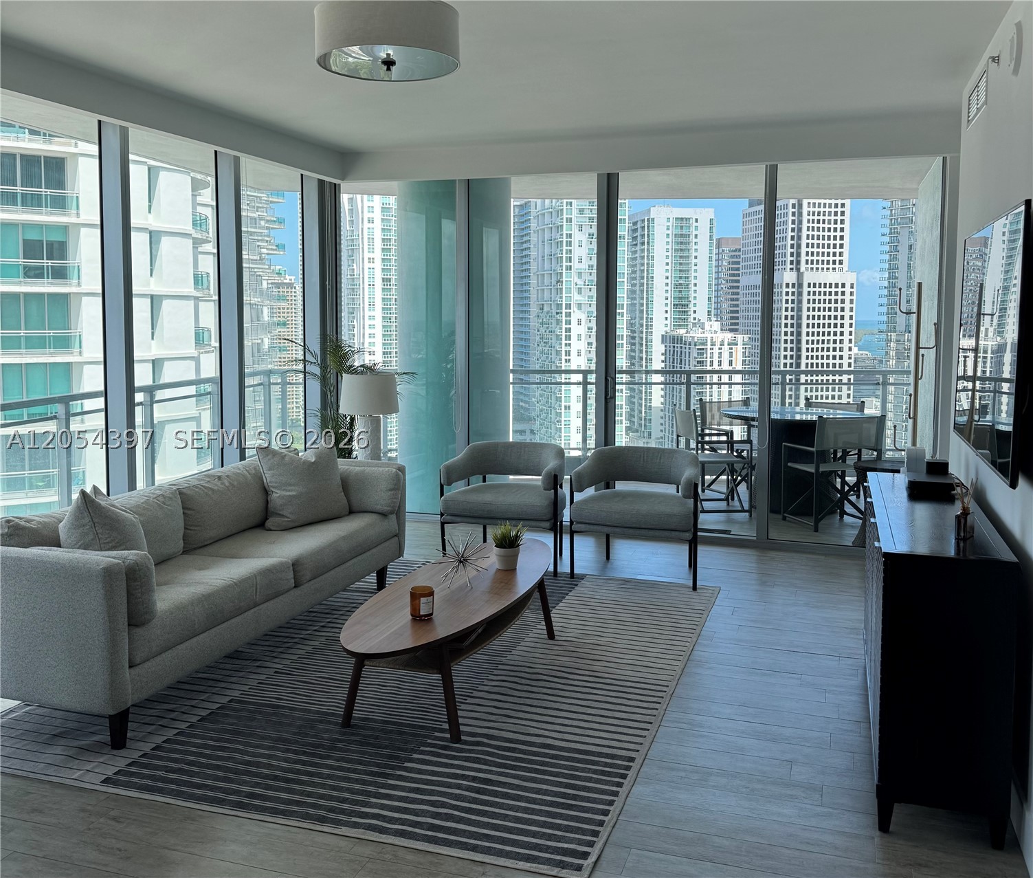 AMAZING 2/2.5 CORNER UNIT, WRAP AROUND BALCONY, WITH CITY AND RIVER VIEWS, FULLY FURNISHED WITH UPGRADED BATHROOMS AND APPLIANCES, 2 PARKING SPACES, CABLE AND INTERNET INCLUDED, EASY HIGHWAY ACCESS, CLOSE TO BRICKELL CITY CENTER