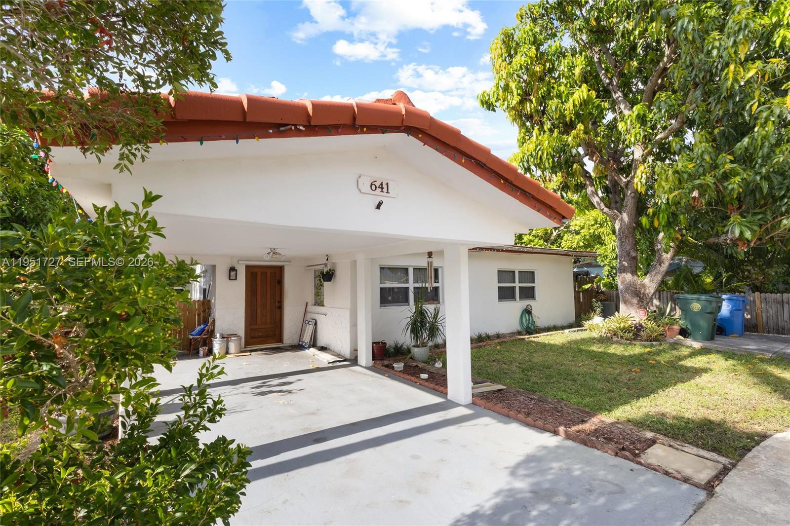 Welcome to this generously sized single-family home offering approximately 1,890 square feet of interior living space, located on a quiet street in the heart of Oakland Park. The main residence features 2 bedrooms and 2 bathrooms with a bright, functional layout and neutral tile flooring throughout. Open living and dining areas provide ample space for comfortable everyday living and entertaining.

The home offers an additional 1 bedroom, 1 bathroom area ideal for guests, extended family, or flexible living, with the option to open it to the main home for a more open and connected floor plan. Two additional dens further enhance the home’s versatility and can be used as home offices, playrooms, or extra living spaces.

The kitchen features ample cabinetry, stainless steel appliances, and a large peninsula with bar seating, perfect for casual meals, entertaining, and everyday use. Enjoy a private backyard with patio space and mature fruit trees, ideal for relaxing or hosting gatherings. Covered carport and extended driveway provide convenient parking.

Concrete tile roof with an estimated 20+ years of remaining useful life.
Centrally located near Wilton Manors, downtown Fort Lauderdale, shopping, dining, beaches, major roadways, and just a short drive to Fort Lauderdale–Hollywood International Airport.
No HOA.