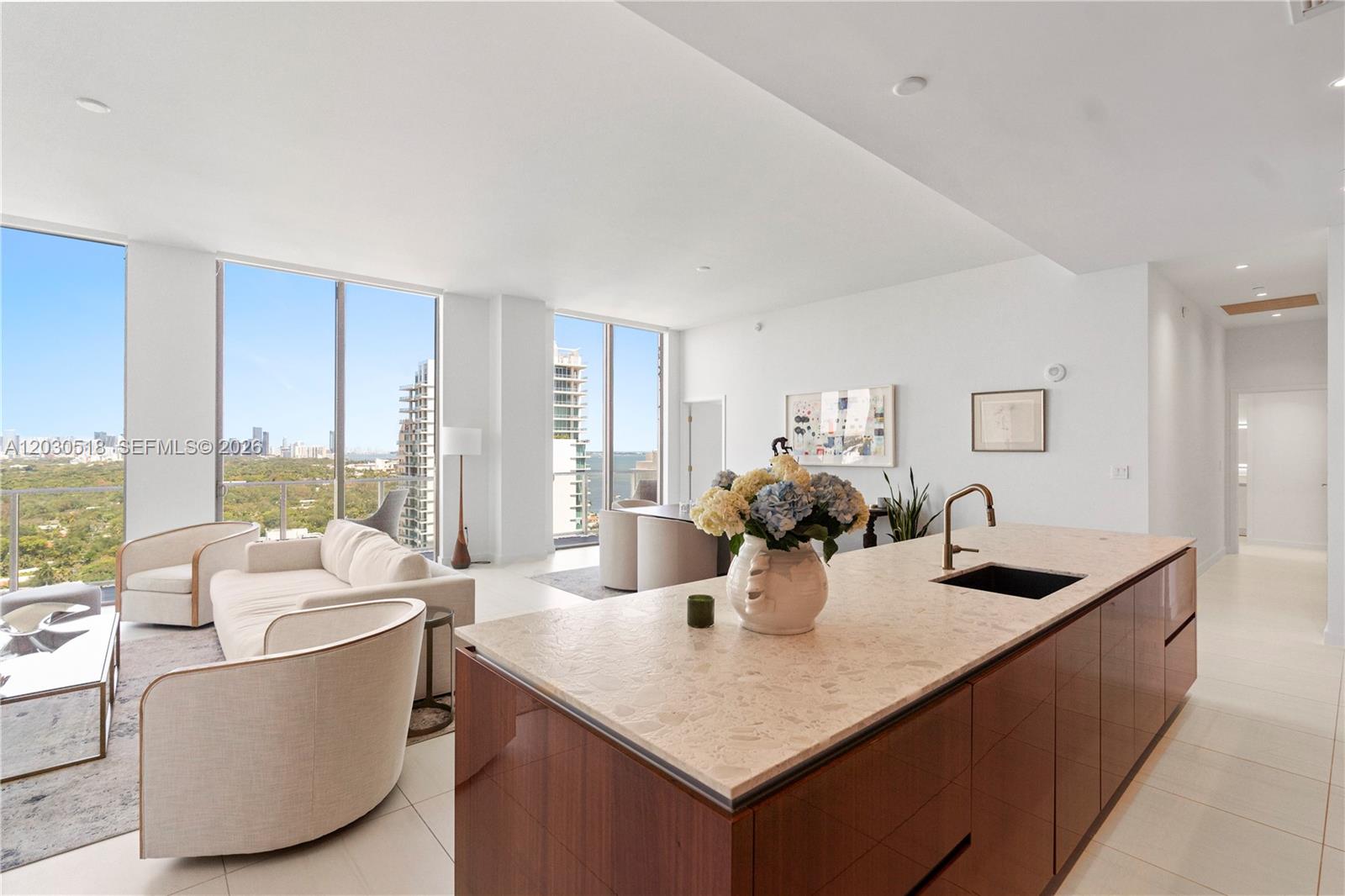 *OFFERED UNFURNISHED OR FURNISHED* Welcome to timeless elegance and modern sophistication in the heart of Coconut Grove. This luxurious Penthouse boasts stunning city and bay views through 11-foot floor-to-ceiling windows, porcelain flooring throughout, and a chef’s kitchen with premium appliances. Enjoy 5-star amenities including a rooftop pool, 8th floor pool shared with complementary cabanas, fitness center, concierge and butler services. A perfect blend of style and sophistication.  Spacious and ready for immediate occupancy. Walk to all that the Grove has to offer, restaurants, shops, parks and marina. If offered furnished, some art will be removed.
