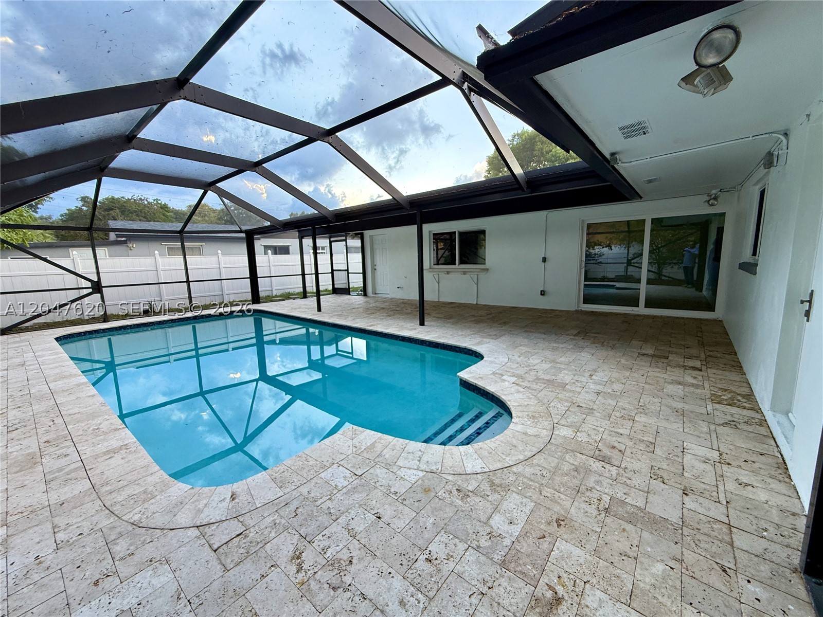 Located in the heart of Pembroke Pines, this One-Story Pool homes features 4 bedrooms and 2 baths (plus a separate room with its own entrance, bath, and AC) No HOA!!. Worry free with a brand new Metal Roof just installed in April 2026, Impact Windows and Doors throughout. Screened Heated Pool and New Pump with a Tavertine Deck, home has both city water and a private well. Garage with AC. The upgraded primary bedroom has its own Split AC Unit, master bath has also been renovated. Kitchen has wood cabinets, and granite top. Ample backyard with fruit trees including Mango, Lime, Soursop, Avocado, Aloe Vera. Big driveway with lots of parking. Centrally located with plenty of shopping and dinning close by. Great schools, and easy access with I-75 and Turnpike close by. EASY TO SHOW, SELLER MOTIVATED!!!