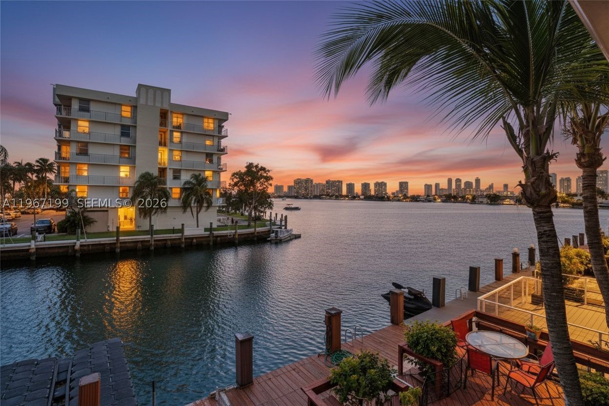 New Price! JUST REDUCED! ~ BOATER’S DREAM ~ Waterfront 3BR/2.5BA townhome with 1,600 SF on the Intracoastal. Open layout, gourmet kitchen with quartz countertops and stainless steel appliances. Spacious living areas open to waterfront patio. Upgraded bathrooms with modern finishes. Primary suite with dual sinks, glass shower, walk-in closet, and private balcony. Laundry room with storage. Private dock fits up to 23-ft boat with ocean access, no fixed bridges. HOA $850/month with reserves. Rentable first year. Walk to dining, shopping & IPIC. 5 mins to beach, 10 mins to Aventura Mall. Easy access to I-95 & airports. Please ask us about the 3-2-1 approved lender buy down. Meaning you get an interest rate as low as 3% with a monthly payment probably lower than what you're paying in rent!! Scroll down to "facts & features", click on "show more", then click "View virtual tour" for your Virtual Interactive Lifestyle Concierge! Ask anything. Explore everything.