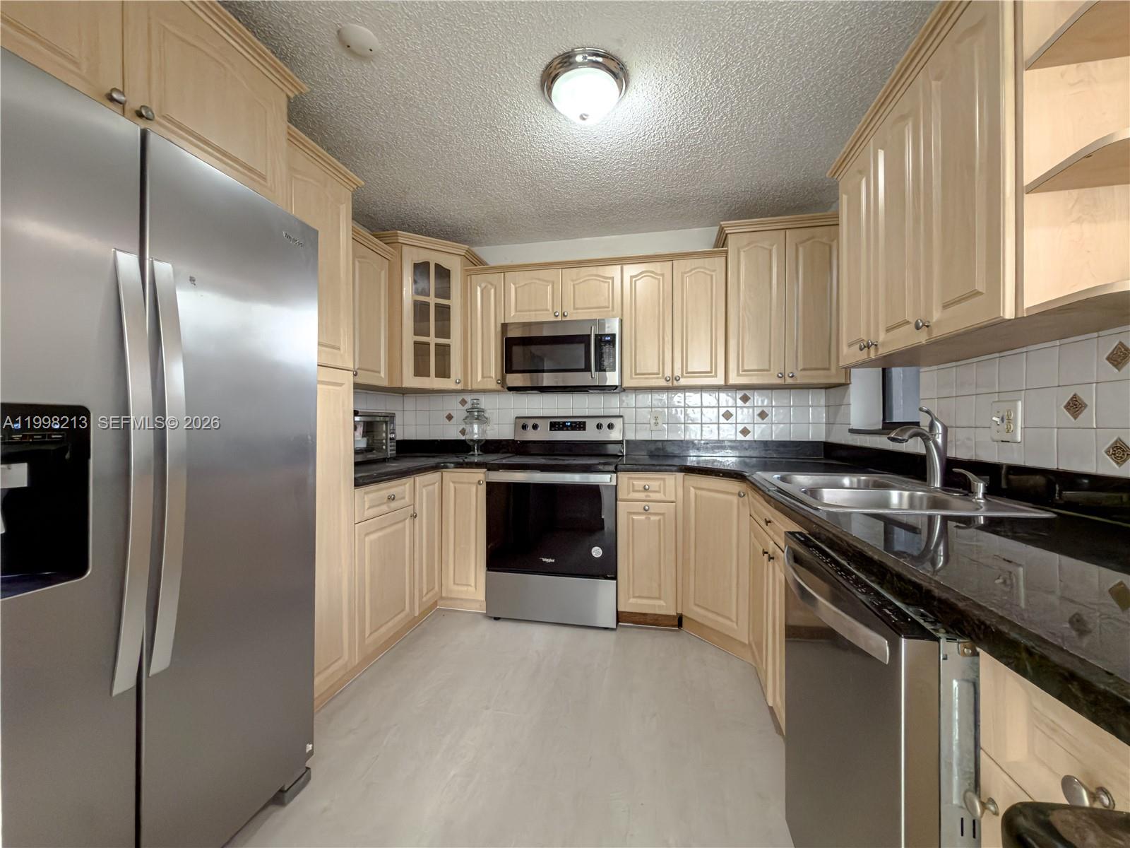 Beautifully remodeled 3 bedroom, 2-bath condo on the first floor.  Large living space, enclosed balcony, new floors, updated bathrooms, remodeled kitchen, comfortable master with walk-in closet, and washer and dryer.  Residents enjoy exceptional resort-style amenities, including clubhouse, Olympic size swimming pool, children's playground, tennis & basketball courts, biking/jogging trails, gym. Close to highways and shopping/dinning Maintenance includes cable and water. Located in The Township in beautiful Coconut Creek. Monthly fees include water & cable.  Schedule your showing today!