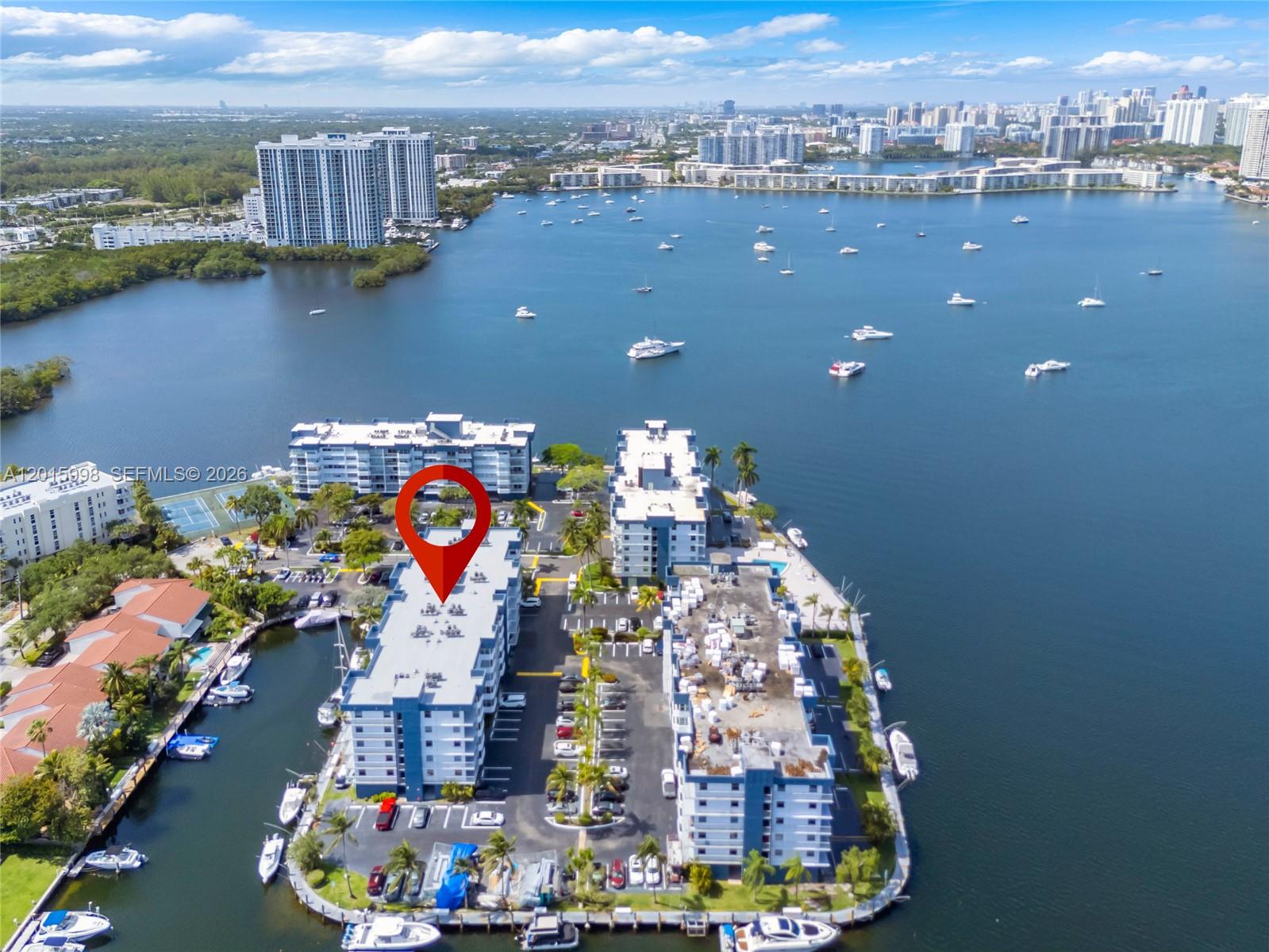 Amazing renovated corner unit located at one of the most desirable condos in North Miami Beach, minutes from the Famous Sunny Isles beach and Aventura mall. This spacious condo features all new High impact windows and sliding doors, ample balcony with ocean breeze all year long. The tower 40 year certification almost done, so no further construction issue in years to come. Unit comes with a great size storage, assigned parking space and plenty of guest spots for visitors. Association is leasing boat slips for residents at a great price, so boaters welcome. Amenities, large pool with water-view deck, tennis courts, gym, BBQ area, 24 hour front gate security and party room. Second floor unit so, easy access for sabbath observers.