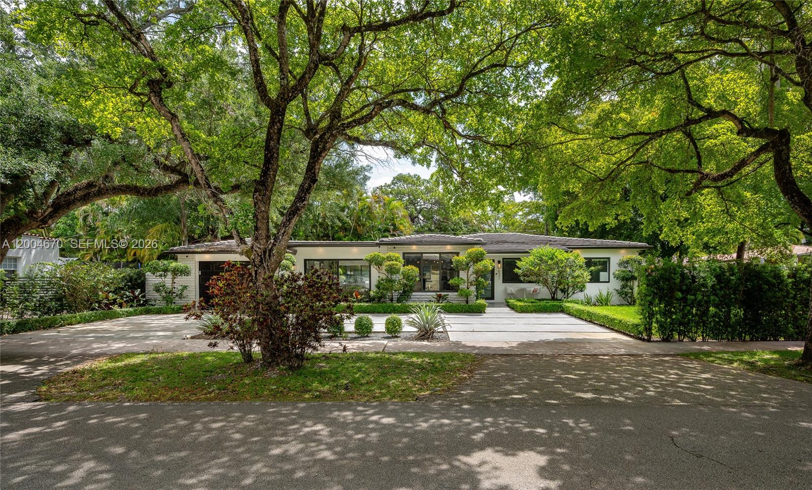 Amazing single-story house in awesome Coral Gables, Miami. Experience refined living in this beautifully reimagined 3-bedroom, 3-bath residence. Fully renovated with a focus on comfort and style, the house highlights a bright open-concept layout, a private tropical courtyard, and a stunning chef’s kitchen outfitted with top-tier appliances. Designed for both everyday living and effortless entertainment. The property features a spacious primary suite and a well-appointed junior suite. Set on a desirable corner lot, the home welcomes you with a brand-new driveway, lush landscaping, and the peace of mind of impact windows throughout. Modern lighting enhances the expansive living spaces. With comprehensive, top-to-bottom renovations, this home offers the rare feel of new construction in one of Miami’s most sought-after neighborhoods. Often called “The City Beautiful,” it was master-planned in the 1920s by George Merrick with a vision of Mediterranean-style design, wide boulevards, and lush green spaces. What makes Coral Gables stand out: Architecture & charm, Lifestyle, Top institutions, Iconic spots, Dining & shopping. In real estate terms, Coral Gables is considered one of the most desirable and stable luxury markets in South Florida. Gorgeous and professionally designed, this home is also offered completely furnished (furniture package is an additional purchase option). A must-see opportunity to own a turnkey home. Do not miss it, this gem will not last long in the market.