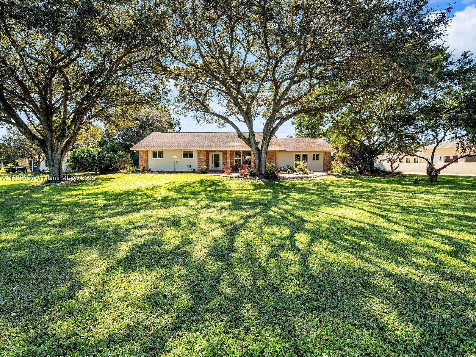 Welcome to your Bounty Of Love ranch. One of a kind eclectic country chic home in the heart of sunshine Ranches. Nestled in a whimsical 2 1/2 acre lush landscaping tropical fruit trees throughout Custom 150k heated resort style pool & Oversized Jacuzzi. Your main house features new roof 2018, 4 bedrooms 3 full baths Formal living room fireplace Dining stunning Zen family room views your oasis, Hand painted kitchen cabinets. Custom oversize gazebo w-built-in wood burning pizza oven, fireplace & barbecue. 4 BR 3 bath in Main house. Detached Cozy cottage has 2 bedrooms 1 bath full kitchen. 3 custom barn stalls With private barn bungalow attached to a Unique full bathroom. Hosts a border or trainer. Large pond Many more nestled corners of treasures a must see To feel the Zen in nature.