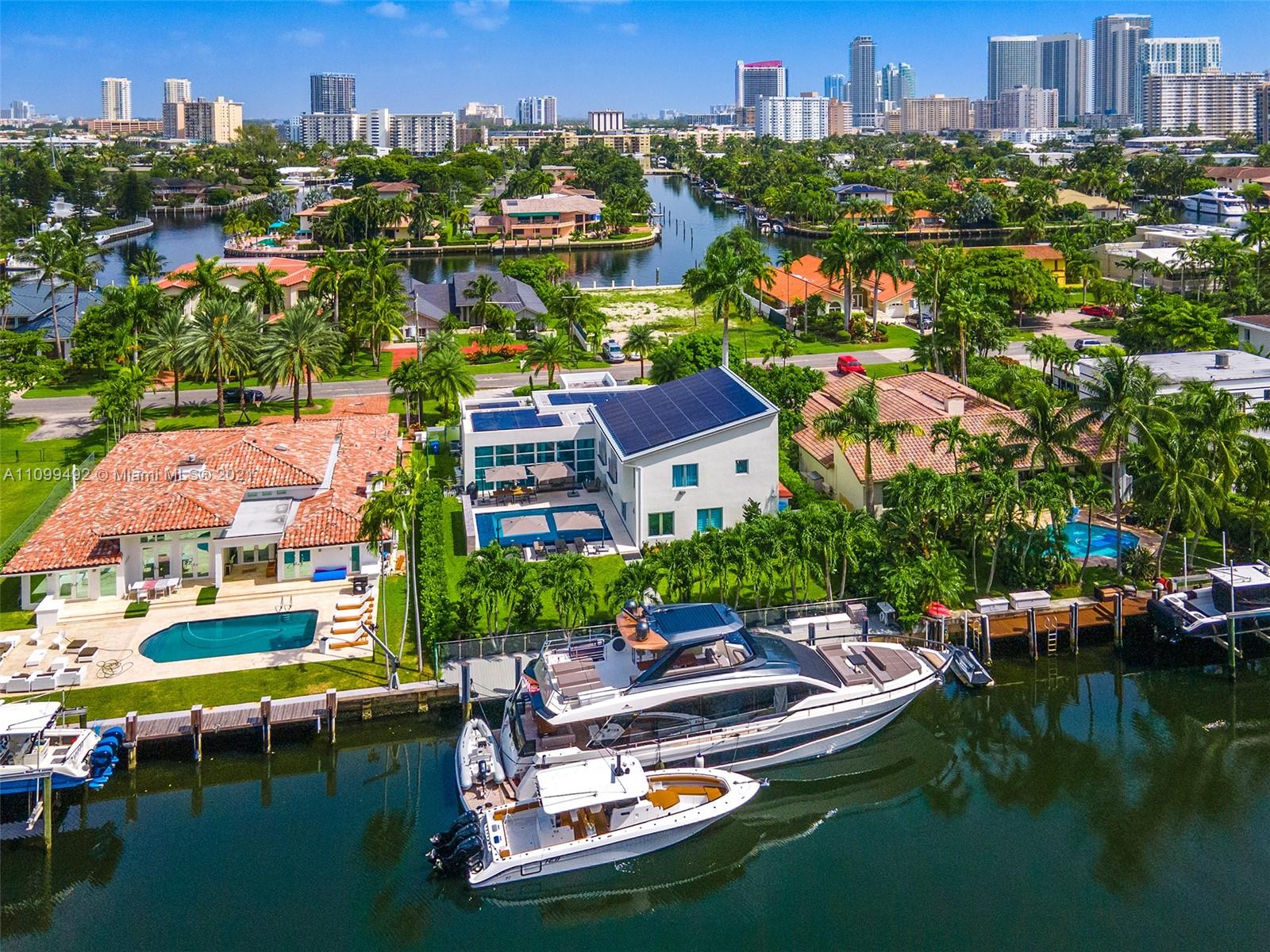Contemporary Waterfront Estate in sought after gated Golden Isles community, one of South Florida’s best waterfront communities. Sun-filled interior including impact windows/doors, motorized blinds, wall coverings, solar panel roof system for renewable energy, 2 car garage and more. Open living, family, dining, and modern kitchen capitalize on the waterfront views, the second story fully comprises the private master suite with a spa-like bath, living & dining areas and balcony overlooking the water and pool area. Resort inspired outdoor area is highlighted by the heated pool, large patio & expansive lawn.