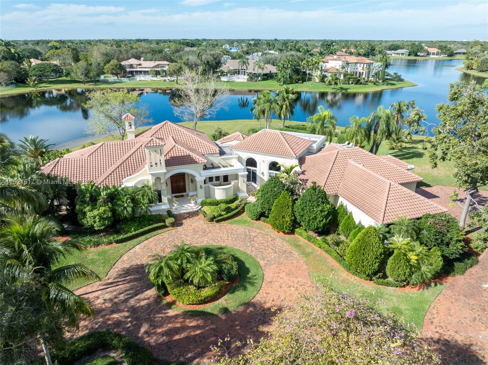 3195 Willow Lane, is an exquisite estate nestled on a sprawling 1.92-acre waterfront lot in Windmill Ranch. This elegant residence boasts over 500 feet of water frontage, offering unparalleled privacy and serenity. The open floor plan with 16-foot ceilings creates a grand ambiance, perfect for entertaining. With 5 bedrooms and 5 bathrooms spread over 5,357 square feet, this home exudes luxury and comfort. The gourmet kitchen is a culinary masterpiece, while the expansive 3-car garage provides ample space for your vehicles. The property's total lot size spans an impressive 84,048 square feet, providing ample room for outdoor activities and potential expansion. Experience the epitome of luxury living in this remarkable Weston community.