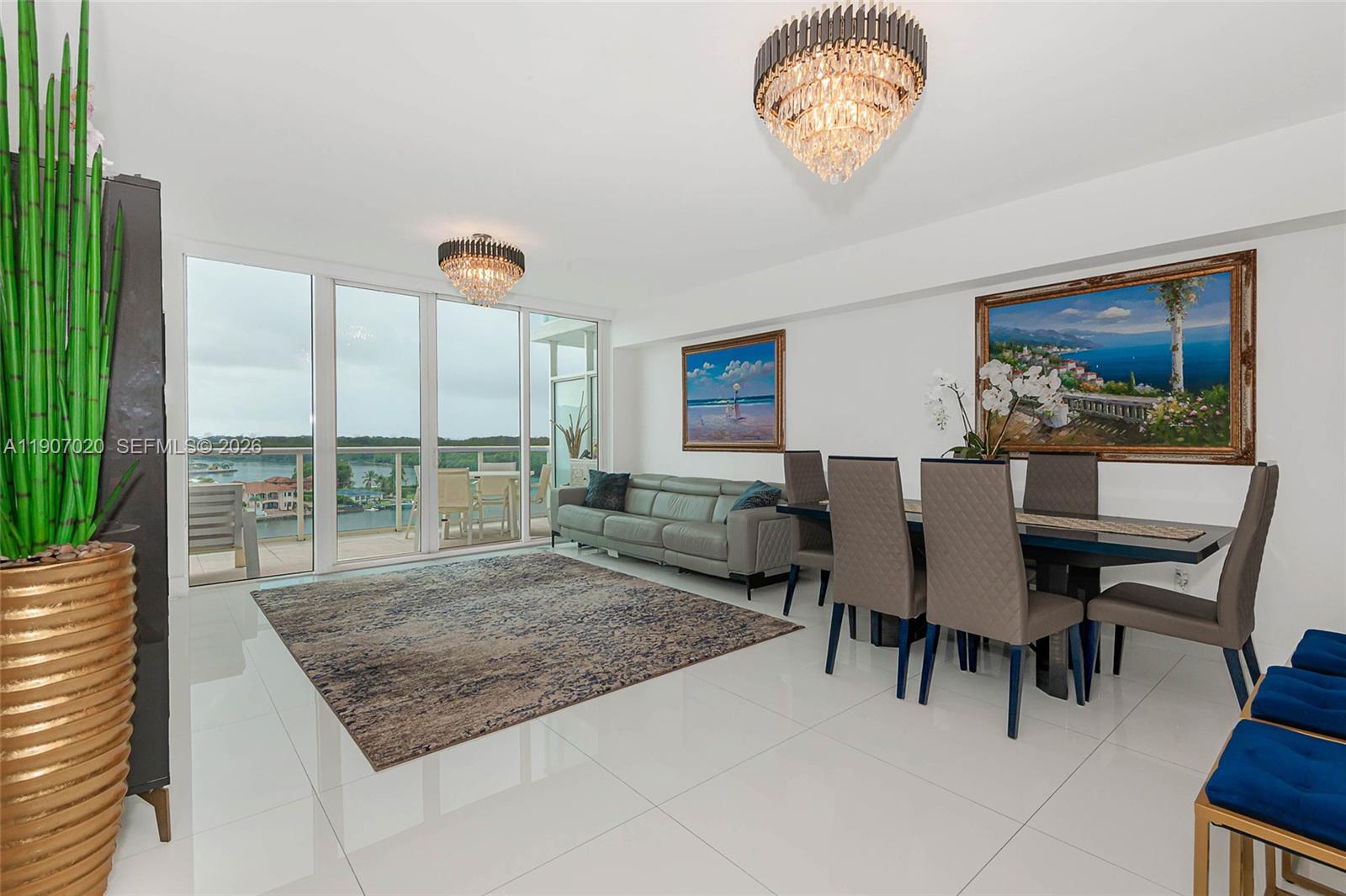 Step into a world luxury and elegance with this stunning 2-story condo offers million-dollar views of Intracoastal, Oleta River Park and Ocean. Boasting 1690 square feet of living space, residence features a unique master bedroom on the second floor, along with 1 bedrooms plus den and 3 luxurious bathrooms. The modern kitchen is equipped for culinary excellence, while a large open balcony offers panoramic views, making it the perfect spot to enjoy the beauty of surroundings. Brand new electric blinds in the entire apartment. The resort style amenities are truly exceptional, offering an infinity lap pool, jacuzzi, a spa, fitness center, pool bar, steam room, meditation garden and a tennis court - all located on the 6th floor.