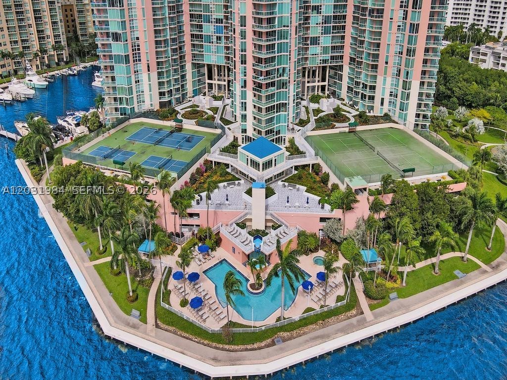 Experience luxury living in this stunning 3-bedroom, 2.5-bath residence in the prestigious Hidden Bay Condominium. Accessed by a semi-private elevator, this exceptional home offers breathtaking panoramic views of the Intracoastal Waterway, the Atlantic Ocean, and the Sunny Isles skyline. Floor-to-ceiling windows fill the residence with natural light, while elegant marble and tile floors, a beautifully renovated kitchen, updated bathrooms, and brand-new appliances add style and sophistication throughout. A private enclosed office with a window provides the perfect work-from-home space and can easily serve as a den or fourth bedroom. The unit includes one assigned parking space, ample guest parking, and a private storage room. Ideally located just minutes from the beach, Aventura Mall, top-rated schools, and major highways. Hidden Bay offers exceptional resort-style amenities including tennis courts, a state-of-the-art fitness center, private marina and yacht club, valet service, and 24-hour gated security.