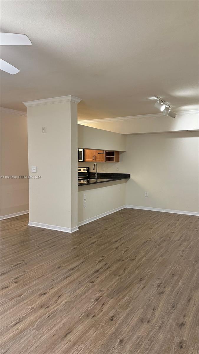 Turnkey first-floor 2 bed/2 bath condo in resort-style Emerald Dunes. One of the largest floor plans in the community with 1,262 sf under air, featuring split bedrooms, a spacious living and dining area, granite kitchen, full-size washer and dryer, private balcony, and a one-car garage just steps from the unit. Enjoy resort-style amenities including two pools, hot tubs, 24-hour fitness centers, tennis courts, clubhouse, business center, and beautifully maintained walking paths. Prime location just minutes from the Turnpike, Publix, shops, dining, downtown West Palm Beach, the Outlets, and PBI Airport. Vacant and easy to show through ShowingTime. HOA approval required. Pet-friendly community.