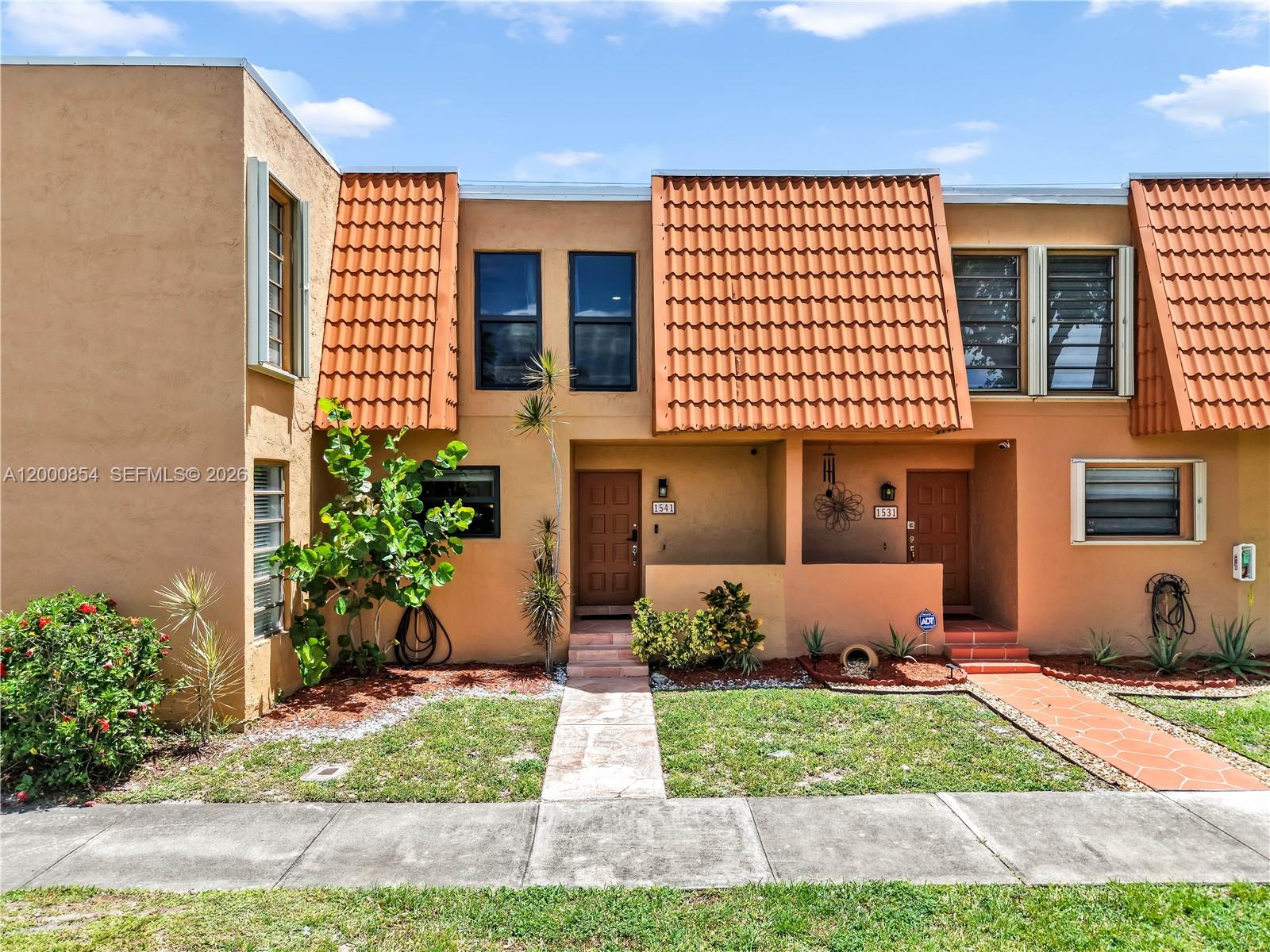 Experience the perfect harmony of style and peace of mind in the heart of Pembroke Pines. This meticulously upgraded residence offers a seamless open floor plan designed for both sophisticated entertaining and effortless daily living. Every detail has been curated for the discerning homeowner. Full hurricane impact windows, a newer A/C system, and a newer water heater ensure comfort for years to come. The interior aesthetic is an expansive layout. The kitchen is a standout, featuring granite countertops, premium stainless steel appliances, and a new double oven perfect for entertaining. Retreat to the oversized primary suite, a true private wing boasting a walk-in shower and a massive California-style dressing room designed for ultimate organization. The living space extends outdoors to a private screened patio, ideal for morning coffee or evening relaxation. This home offers the ultimate lock-and-leave lifestyle; the inclusive monthly association fee covers Internet, Cable, exterior insurance, and meticulous grounds maintenance. Residents enjoy resort-style amenities including two sparkling pools, tennis courts, a clubhouse, and a fully equipped gym. Perfectly positioned just minutes from top-rated schools, with rapid access to premier shopping, dining, medical centers, and major highways. This is more than a home; it is a retreat of comfort, style, and total convenience in one of Broward’s most sought-after locations
