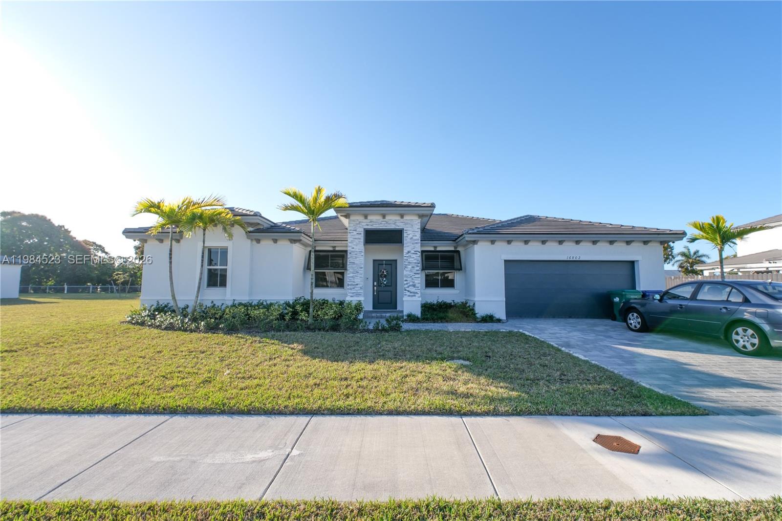 Discover refined living in this beautifully appointed residence nestled in one of Homestead’s most desirable and rapidly growing communities (No HOA). Designed with both elegance and comfort in mind, this home showcases a bright, open-concept layout enhanced by abundant natural light and thoughtfully curated living spaces. The seamless flow between interior and exterior areas creates an ideal setting for both sophisticated entertaining and relaxed everyday living. Step outside to an expansive backyard offering endless possibilities to design your own private oasis—perfect for outdoor gatherings, a custom pool, or serene retreat. Ideally located just minutes from major highways, premier shopping, dining, and top-rated schools, this home offers the perfect balance of tranquility and convenience. A rare opportunity to own a home that embodies style, space, and South Florida living at its finest. Schedule your private showing today.