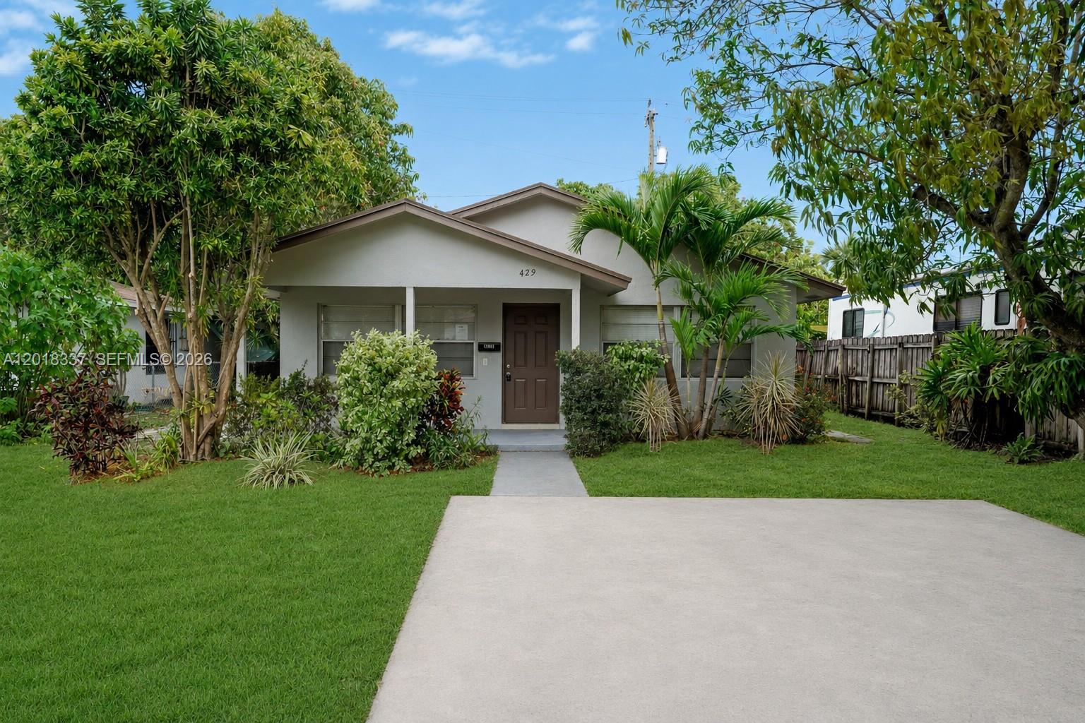 Welcome to this single-family home featuring 3 bedrooms, 2 bathrooms, and 1,401 sq ft of comfortable living space. This home offers tile floors throughout, a spacious driveway, and a fenced yard with mature fruit trees perfect for enjoying the outdoors. Inside, you’ll find an open kitchen with stainless steel appliances, a walk-in closet, and washer and dryer hookups for added convenience. No HOA. Ideally located near the I-95 expressway, just 15 minutes from the beach, and close to Palm Beach International Airport, shopping, dining, and entertainment.