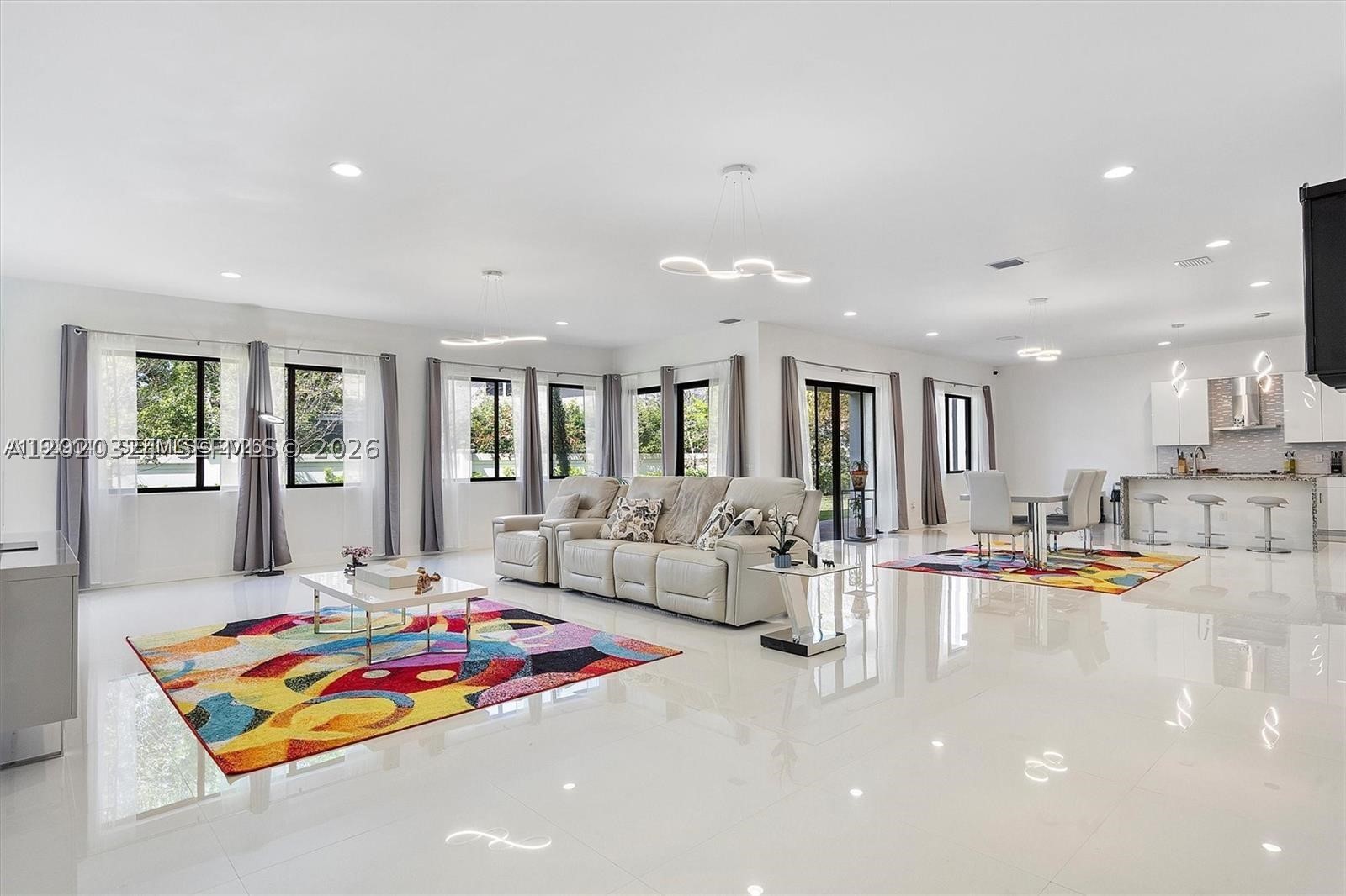 Located in the gated Marbella Miramar community, this spacious two-story home offers over 4,000 sq. ft. of comfortable living with thoughtful upgrades throughout. The home features porcelain tile on the first floor, laminate flooring upstairs, a 3-car garage with polyurea flooring, and a large driveway with space for up to 8 vehicles. The kitchen is designed for everyday use and entertaining, with granite countertops, stainless steel appliances, and a generous pantry. Downstairs, there is a flexible room with its own full bathroom, currently used as a gym, but ideal as a bedroom, office, or guest suite. Upstairs, the primary suite includes a large walk-in closet and a well-appointed bathroom with dual vanities, a soaking tub, and a separate shower. Two additional bedrooms, full bathrooms with showers, and an open office area that can be converted into a large bedroom complete the second floor. The exterior adds even more appeal with a marble facade, modern lighting, and video security. A great opportunity to own a beautifully upgraded home in one of Miramar’s desirable gated communities.