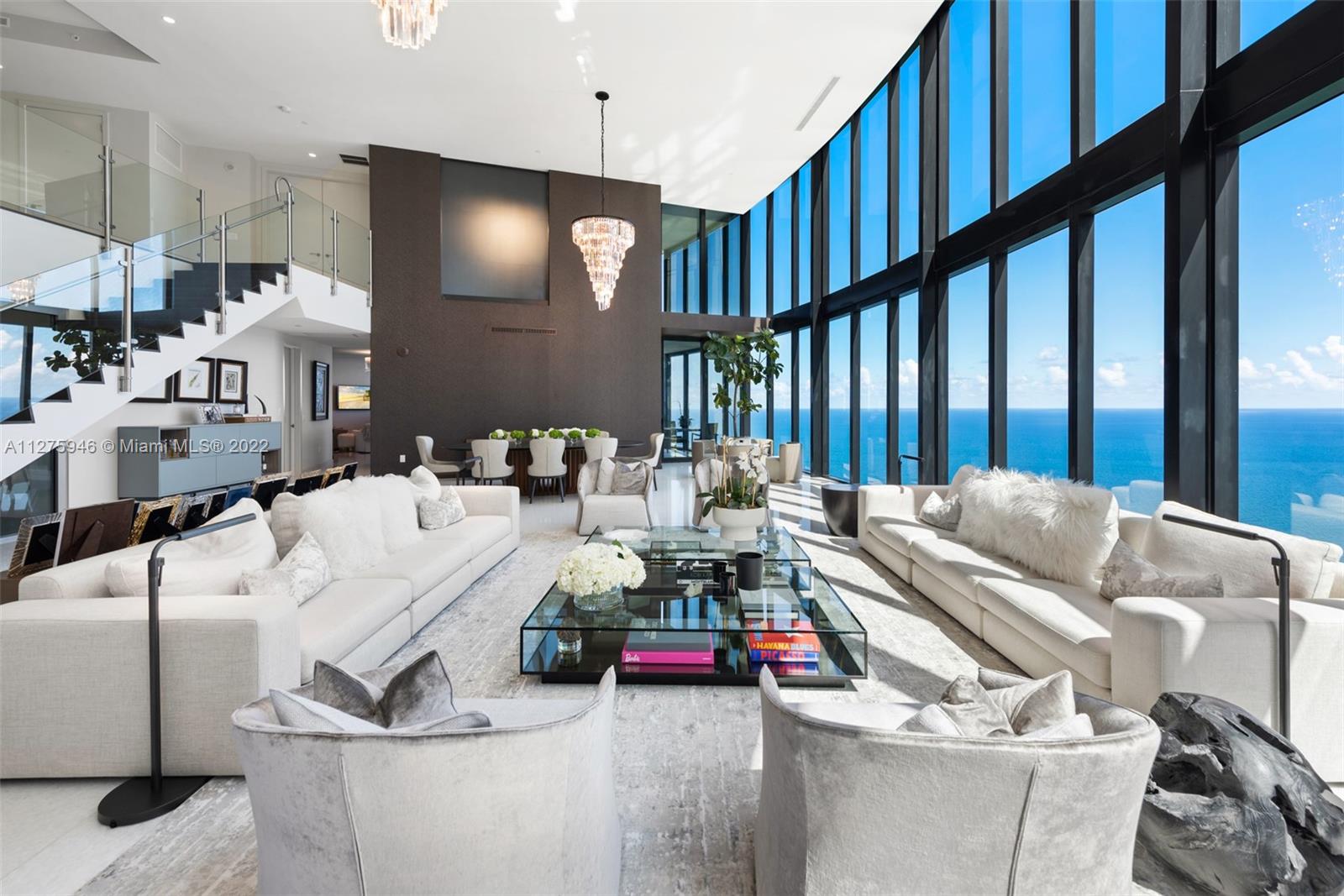 This is the last lower PH, a true high-end oceanfront residence, ( Double level floor plan with 22 foot windows in the living room ) 48x48 Italian marble floors flow throughout, two spectaculars master suites,2 impresive terraces equipped with a ultra modern pool, summer kitchen, lounging area as well a enclose terrace for a beautiful breakfast or a romantic dinner. One of the few units with 4 car garage and a private elevator inside the unit, private beach club for residents only, beautiful sunset pool, building amenities: Movie theater, private restaurant, state of the art gym, VRX motion Z-55 racing simulator.