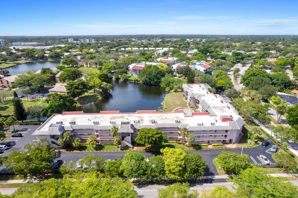 Discover this beautiful, move-in-ready 2-bedroom, 2-bathroom condo with breathtaking lake views. Located on the first floor for easy access, this unit boasts a large living area and includes an in-unit washer and dryer, also a space for storage inside the bldg . Enjoy peaceful moments on your private, screened patio overlooking the water. The community enhances your lifestyle with a pool and clubhouse, all for low maintenance fees and plenty of guest parking. Situated in the heart of Coral Springs, you’re just moments from fantastic shopping, dining, and excellent schools. This exceptional condo is easy to show—schedule your private tour today!