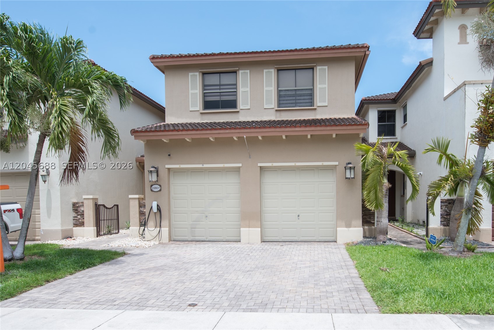 Welcome to Trellis at Bayshore! This beautifully maintained 2-bedroom, 1.5-bath home offers stylish finishes and exceptional indoor-outdoor living. The main level features tile flooring, crown molding, window shades, and a bright living room with French doors, tray ceiling, and abundant natural light. The kitchen boasts white cabinets, granite countertops, stainless steel appliances, pantry, pass-through, and eat-at counter. The dining area opens to a covered, tiled patio with ceiling fan/light. A half bath with a barn door completes the first floor. Upstairs offers laminate flooring, a guest bedroom with blackout shades, ceiling fan/light, and wall closet. The full bath features dual sinks, tub/shower, and storage shelving. The spacious primary bedroom includes a tray ceiling, zebra blackout shades, ceiling fan/light, double-door entry, and dual built-in closets. The primary bath offers a makeup vanity, walk-in shower with dual and rain shower heads, and travertine finishes. Laundry room includes washer, dryer, folding counter, and shelving. Office with A/C vent. A/C replaced in 2026. Two-car garage with automatic opener, overhead cabinets, under-stair storage, and water heater storage. Backyard features tile, turf, shade sails, and lighting. PROOF OF FUNDS AND/OR PRE-APPROVAL LETTER REQUIRED PRIOR TO SCHEDULING A SHOWING OF THE PROPERTY!