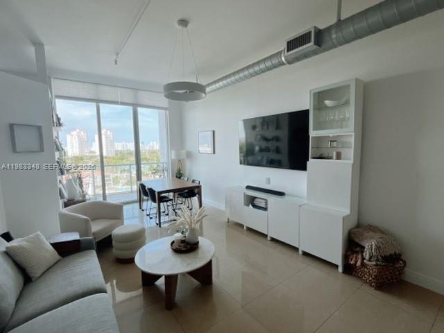 Stunning 3-bedroom, 2-bathroom industrial-chic loft at Uptown Marina Lofts in Aventura. This bright unit features 11-foot ceilings, sleek tiled floors, and floor-to-ceiling glass windows leading to two private balconies with serene Intracoastal and canal views. The modern kitchen is equipped with premium cabinetry and stainless steel appliances. Residents enjoy luxury amenities including a 24-hour attended lobby, resort-style pool, state-of-the-art fitness center, spa, and a private 29-slip marina. Located just minutes from the Aventura Mall, fine dining, and Sunny Isles beaches.
It features 2 balconies, a remodeled pool and tennis court as of 2026, and has a well managed HOA.