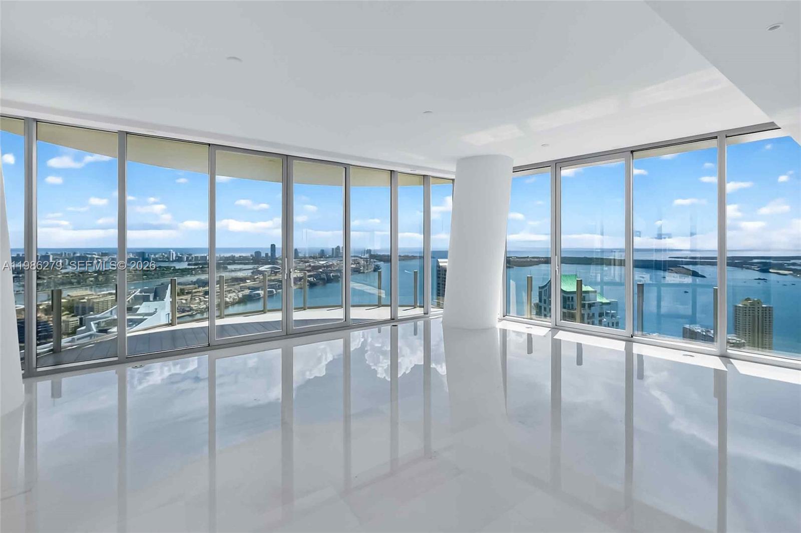 Exceptionally rare and offered unfurnished, this spectacular brand-new residence at the iconic Aston Martin Residences Miami has never been lived in and delivers a truly unmatched waterfront lifestyle.
This expansive 4-bedroom, 6-bathroom plus powder room home showcases breathtaking 180-degree unobstructed views of Biscayne Bay and the Miami skyline, along with a private elevator lobby, two assigned parking spaces side by side in the 4 floor a generous open floor plan, and top-of-the-line finishes throughout.
Designed for both sophisticated entertaining and everyday comfort, the grand living areas flow seamlessly, while each bedroom offers the privacy and ambiance of a personal retreat.
Residents enjoy access to an extraordinary collection of world-class amenities, including a private marina, a state-of-the-art two-level fitness and wellness center, and the exclusive Sky Deck on the 52nd floor, featuring a spa, swimming pool, and full-service concierge.
Set within one of Miami’s most prestigious residential towers, just moments from the city’s finest dining, nightlife, and entertainment, this residence represents the pinnacle of contemporary luxury living.